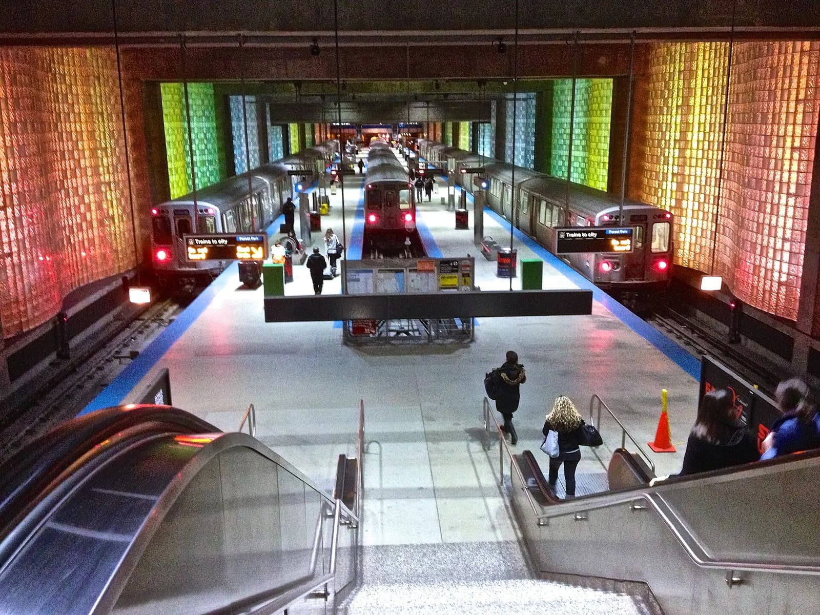 The CTA Blue Line O'Hare station platform sits beneath signage marking the downtown Chicago connection.