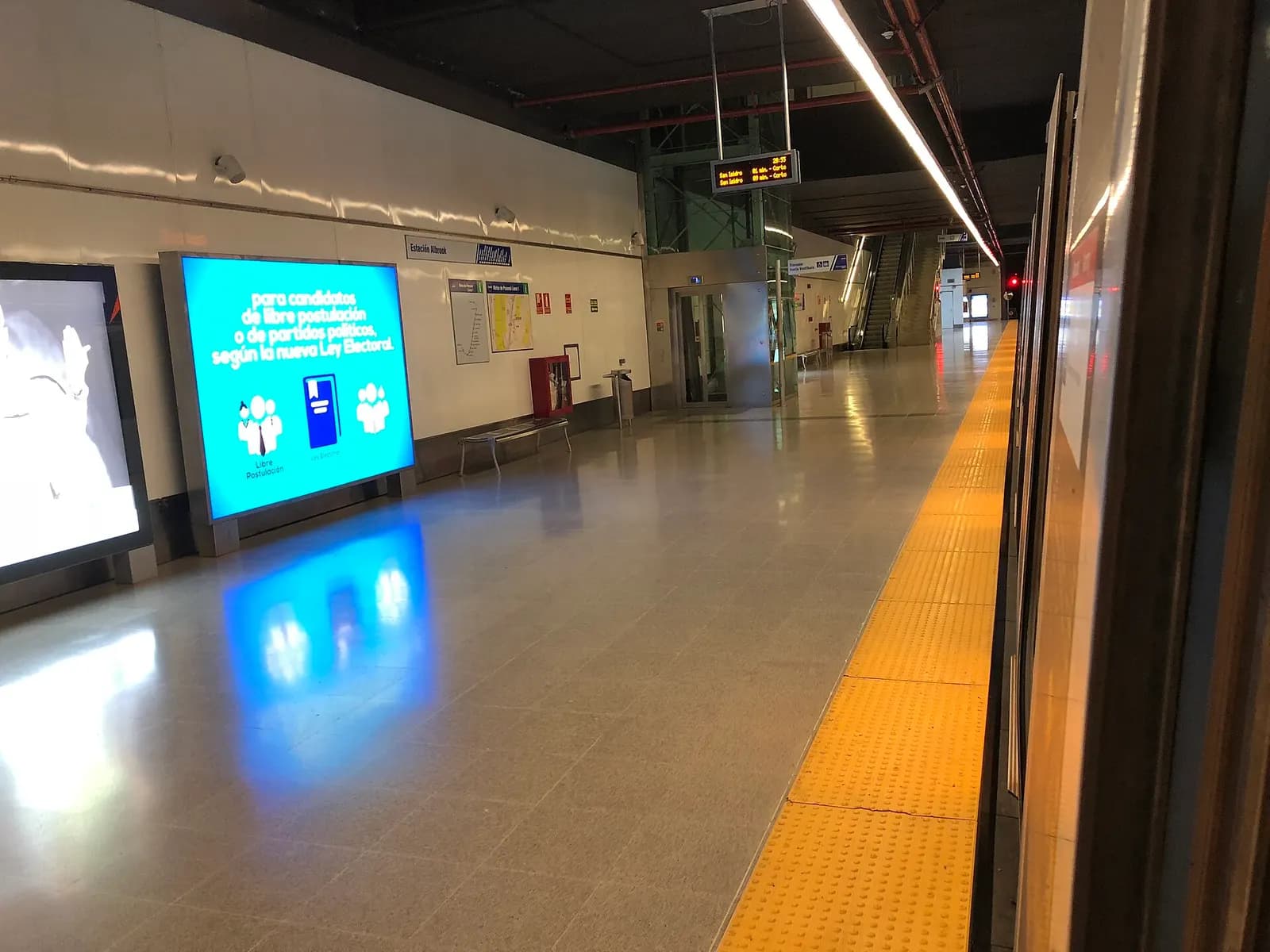 Covered Panama Metro platform at Albrook with overhead signs and waiting space.