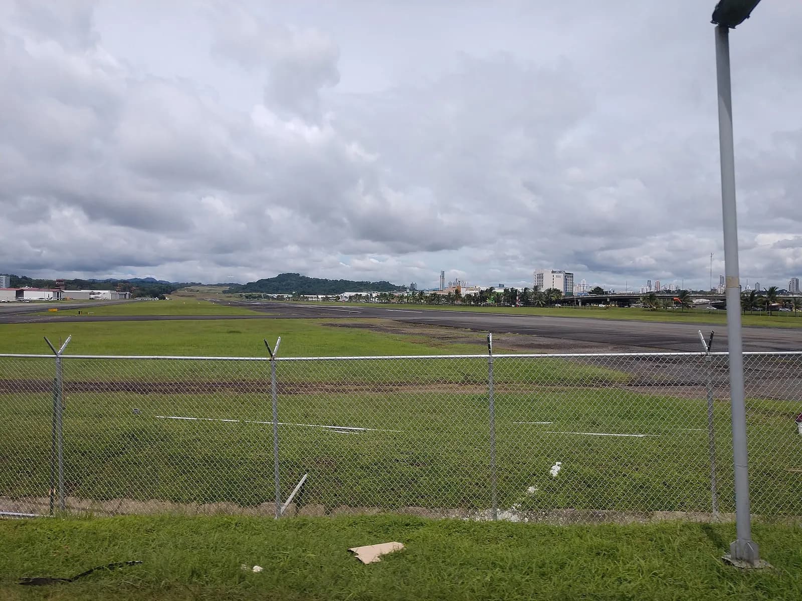 View along the runway and airfield at Aeropuerto Marcos A. Gelabert under open sky.