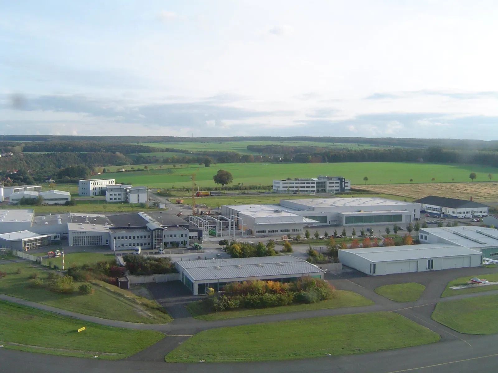Aerial approach view over Paderborn Lippstadt Airport grounds