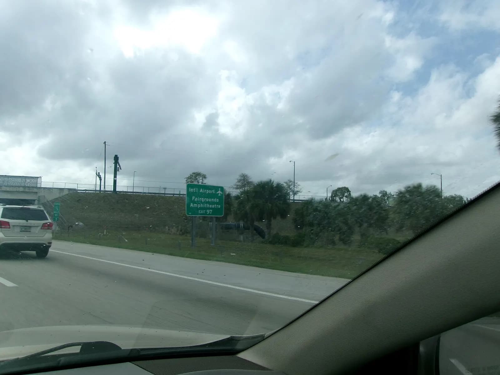 Florida Turnpike southbound sign for Palm Beach International Airport, Fairgrounds and Amphitheatre at Exit 97.