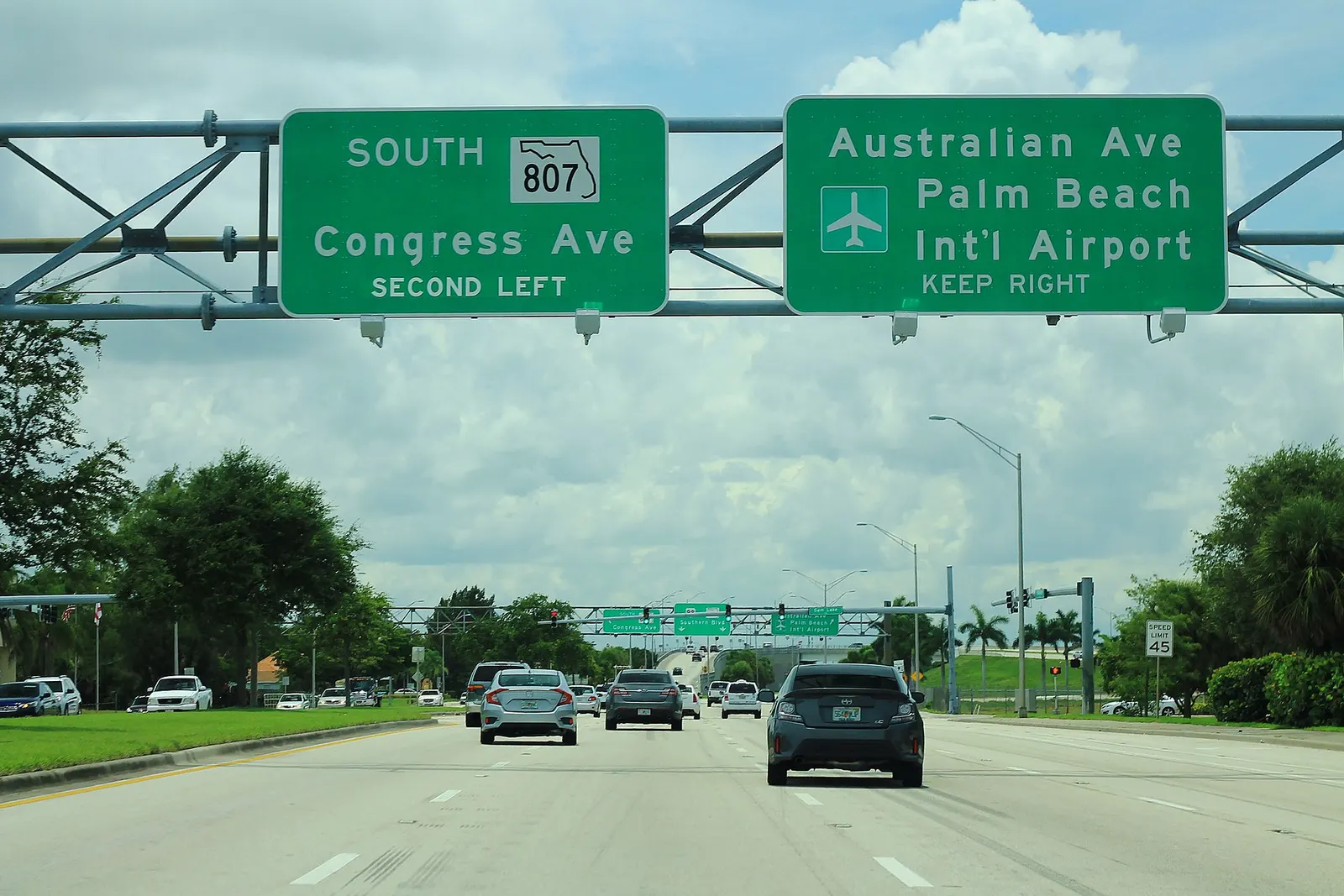 Southern Boulevard (US 98 / FL 80) guide sign with PBI / Palm Beach International Airport to the right.