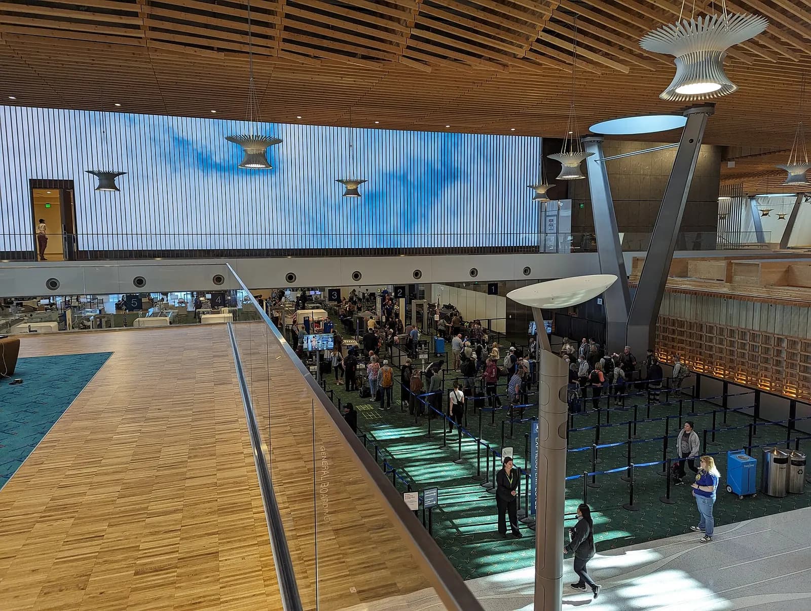 Interior of the newly re-opened terminal at Portland International Airport in Portland, Oregon. From above the security checkpoint, and a small patch of the old carpet is visible on the left.