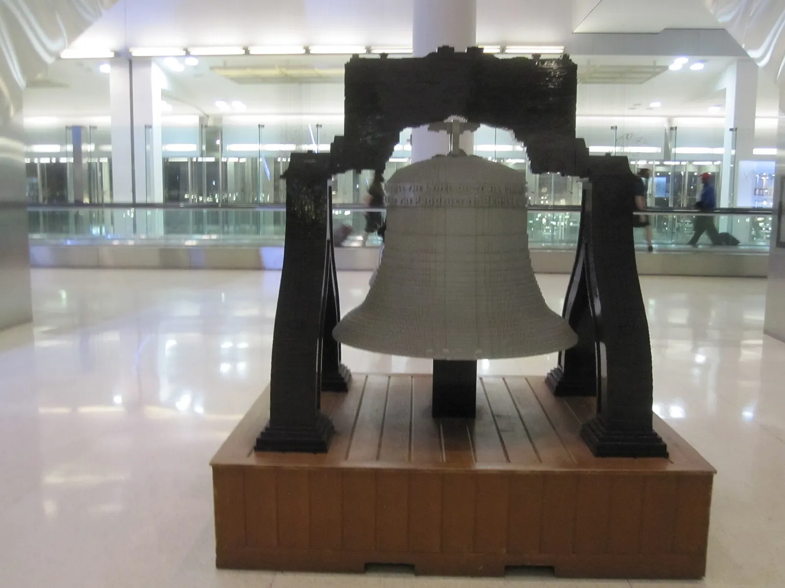 A large LEGO sculpture of the Liberty Bell on display inside the airport terminal.