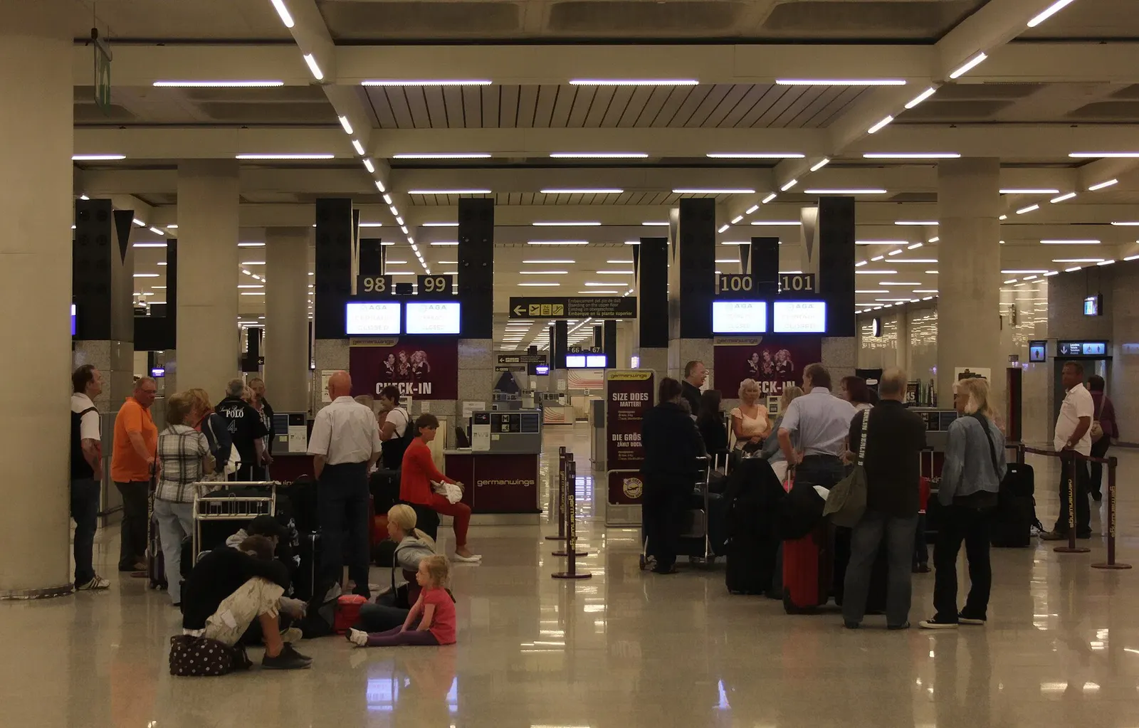 A row of Germanwings check-in counters with airline signage and queue barriers in the departures hall at Palma de Mallorca Airport.