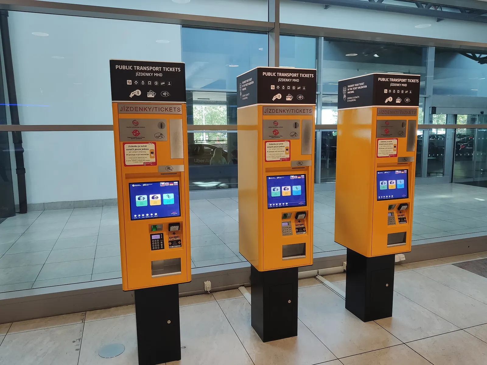 Ticket vending machines for Prague public transport (MHD) installed inside Václav Havel Airport Prague for buying bus and metro passes.