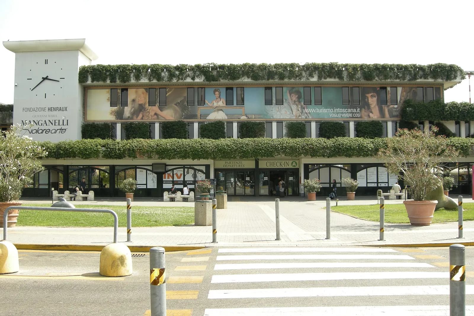 Exterior of Pisa International Airport Galileo Galilei on a clear day.