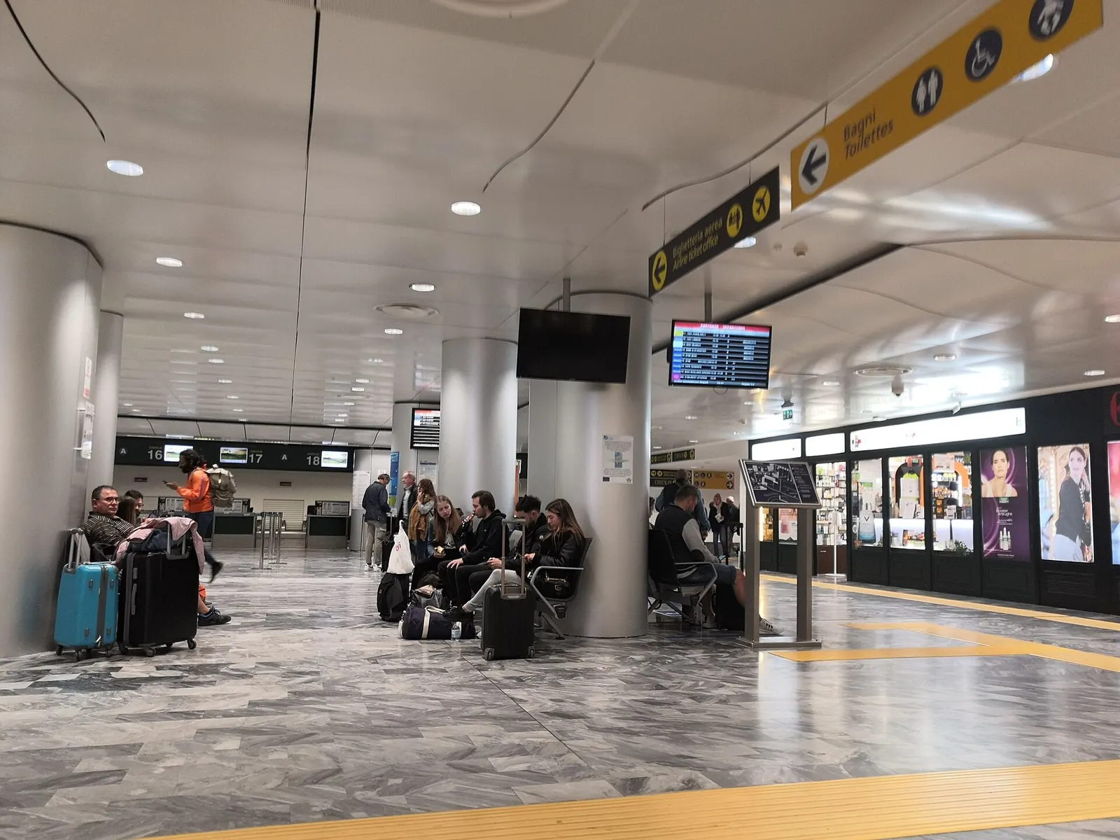 Check-in and landside hall inside Pisa International Airport Galileo Galilei.