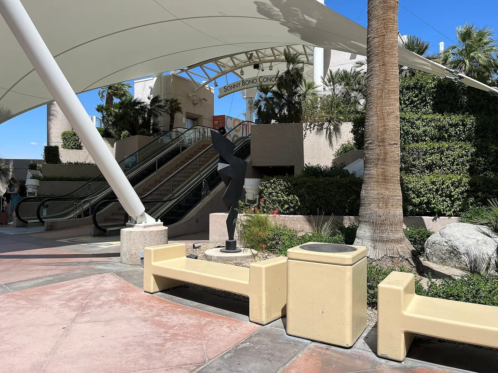2024 exterior of Palm Springs International Airport showing the terminal and desert setting.