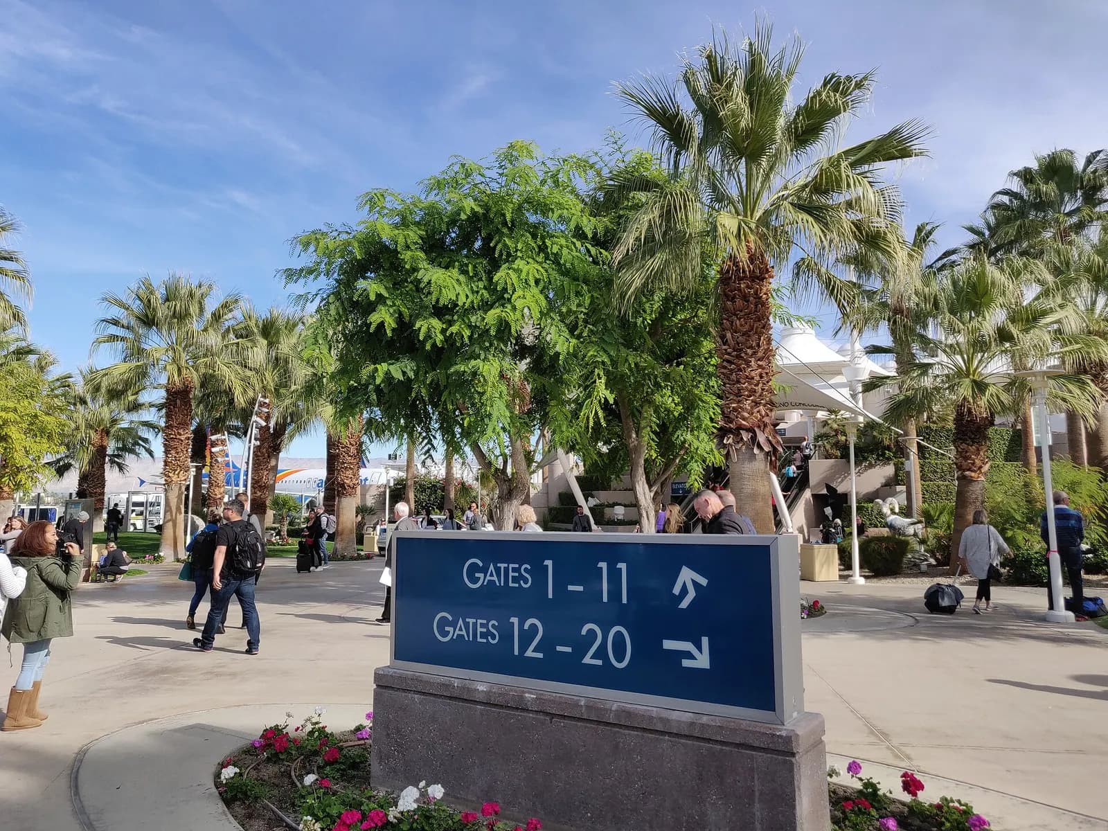 Gate number signs on the Palm Springs International Airport airside walk.