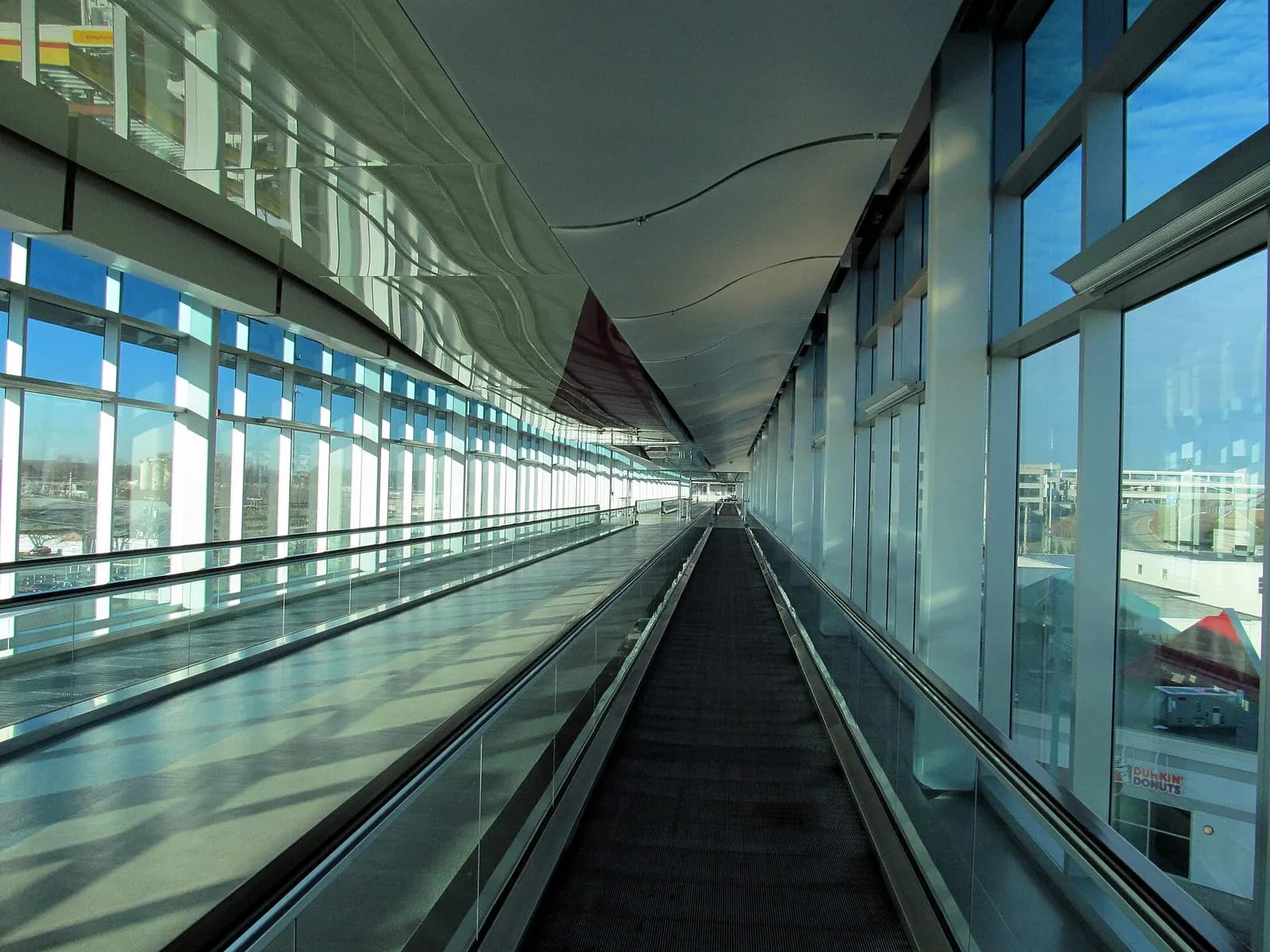 Moving walkway inside the glass InterLink skywalk at T.F. Green Airport.