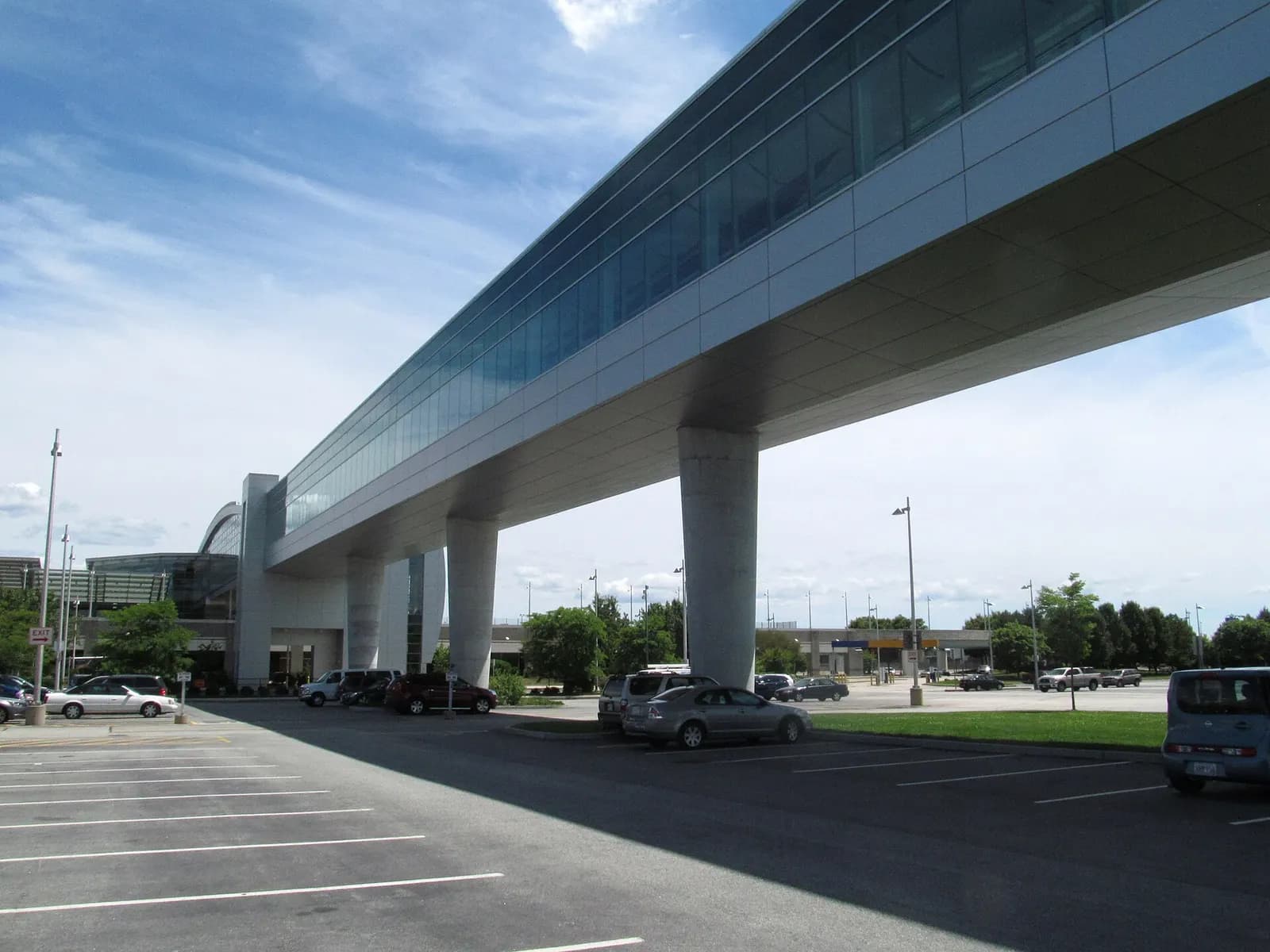 Exterior of the InterLink skywalk on columns, connecting the Sundlun Terminal to the rail and rental-car garage.