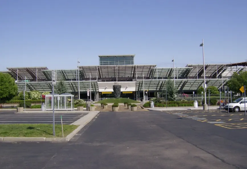 Landside face of the Bruce Sundlun Terminal at T.F. Green, with the sawtooth glass canopy over the entrance.