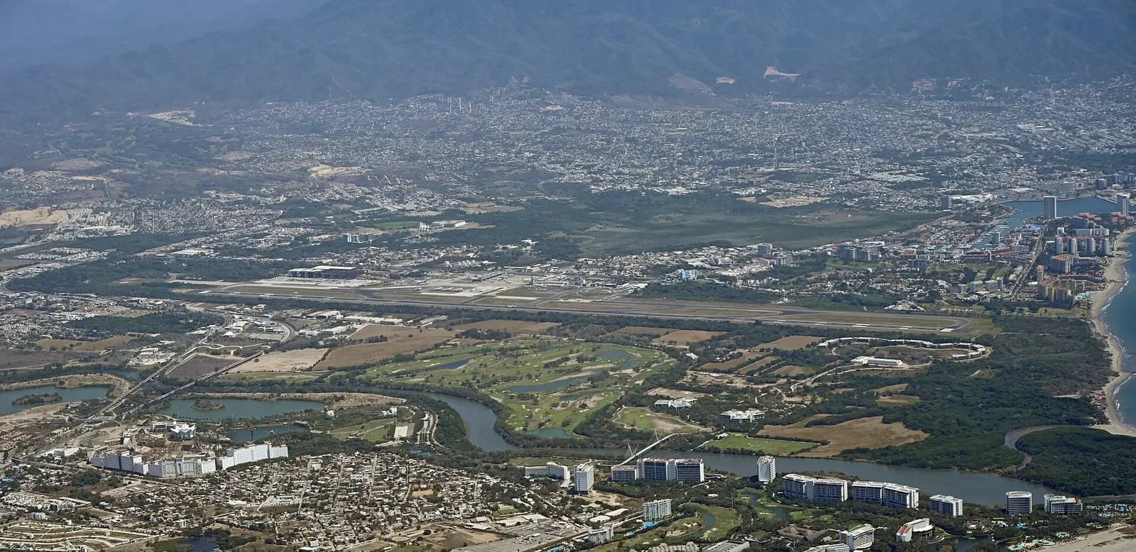 Licenciado Gustavo Díaz Ordaz International Airport taken from the air facing southeast.
