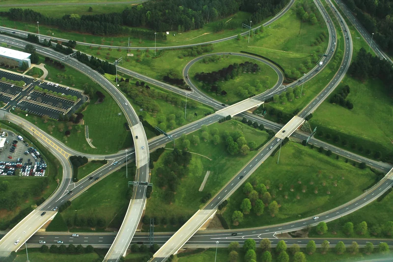 An aerial view of RDU showing Aviation Parkway and Airport Boulevard intersecting near the terminal area and surrounding airfield.