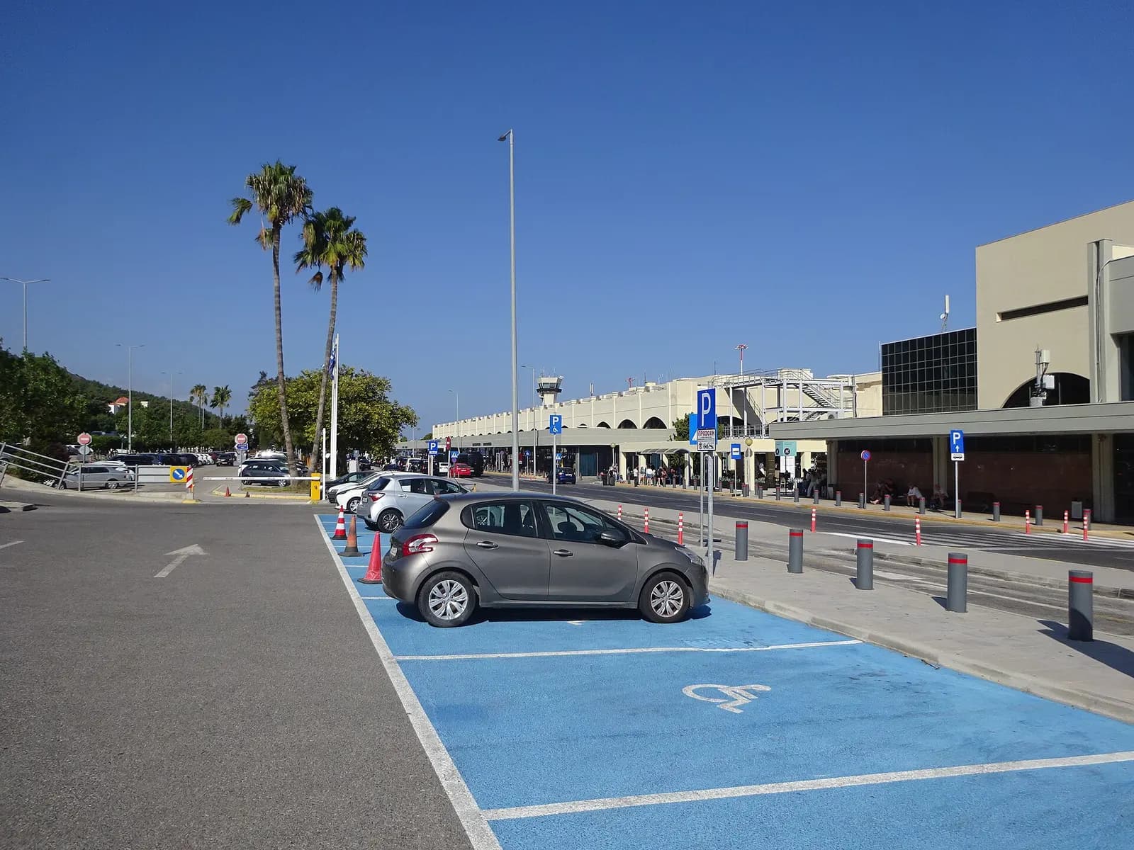 Accessible parking bay signage at Rhodes Diagoras Airport in August 2025.
