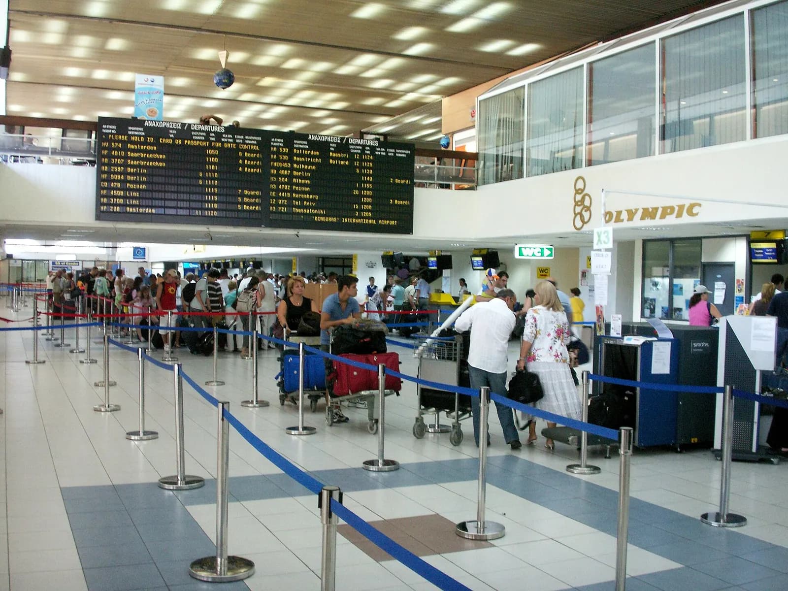 Check-in and bag-drop counters inside Rhodes Diagoras Airport.