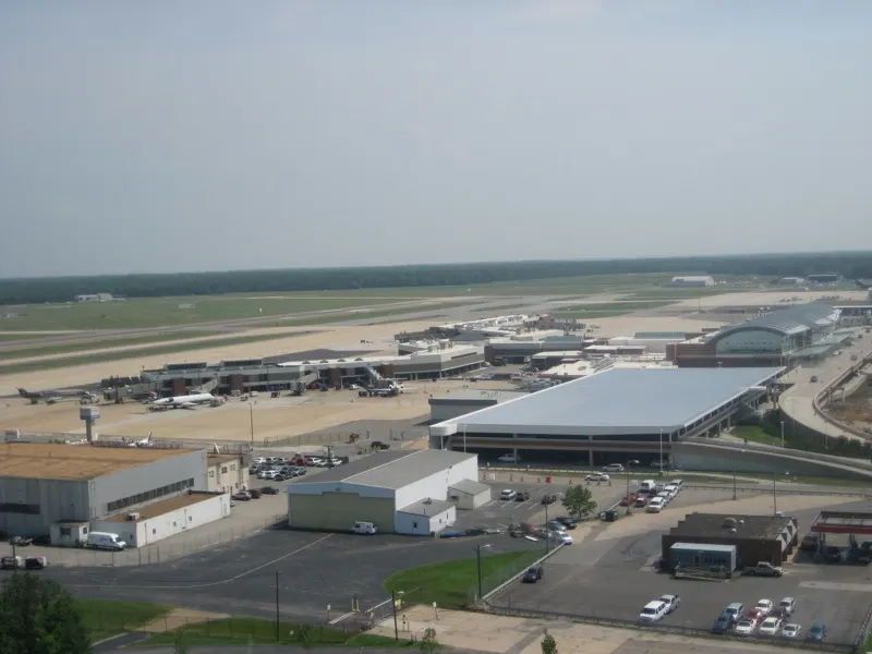 Aerial view of Richmond International Airport showing the two-level terminal, parking garage, and the A and B concourses on the airfield.