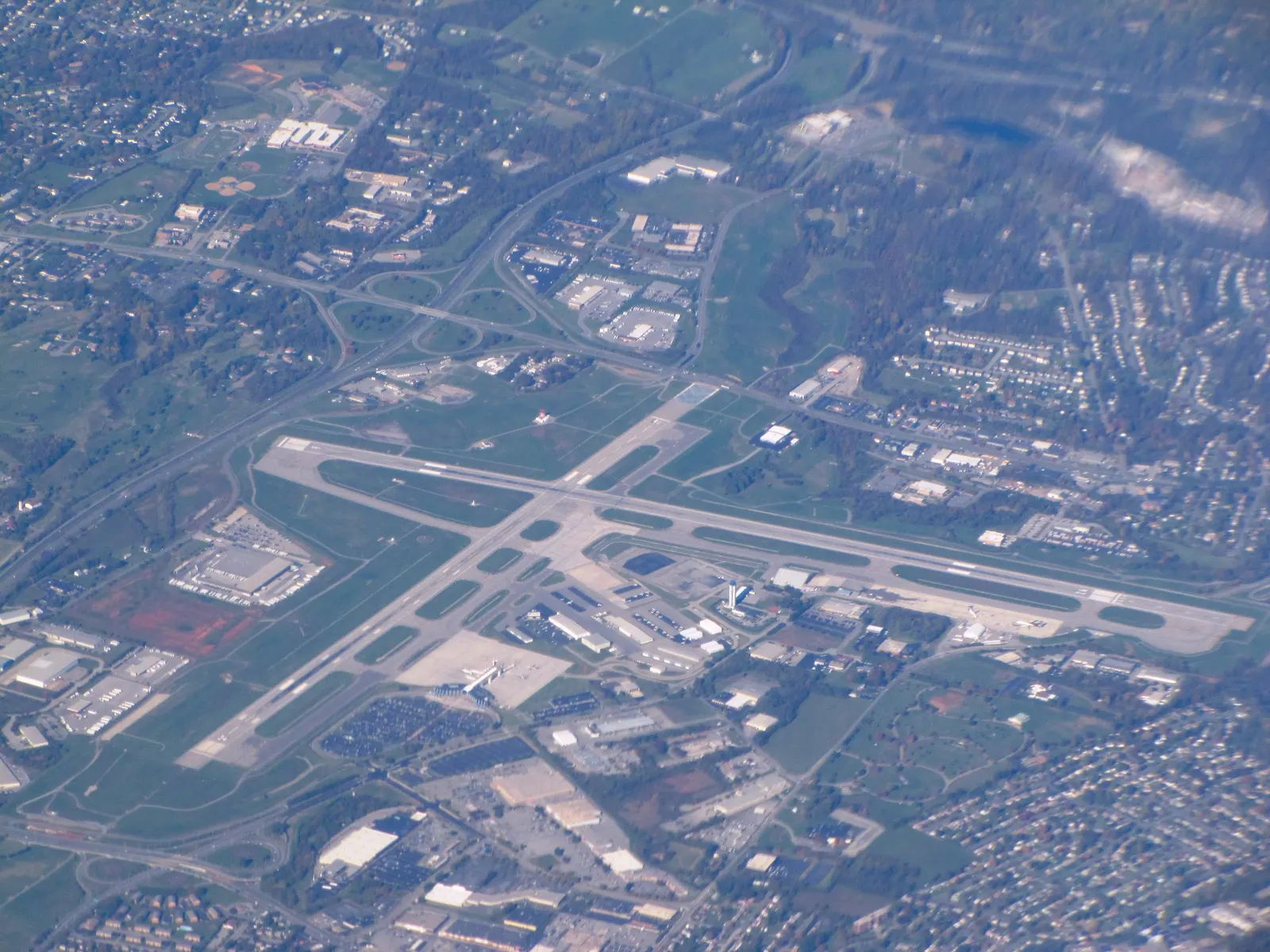 October 2011 aerial of Roanoke Regional Airport showing crossed runways and the passenger terminal.