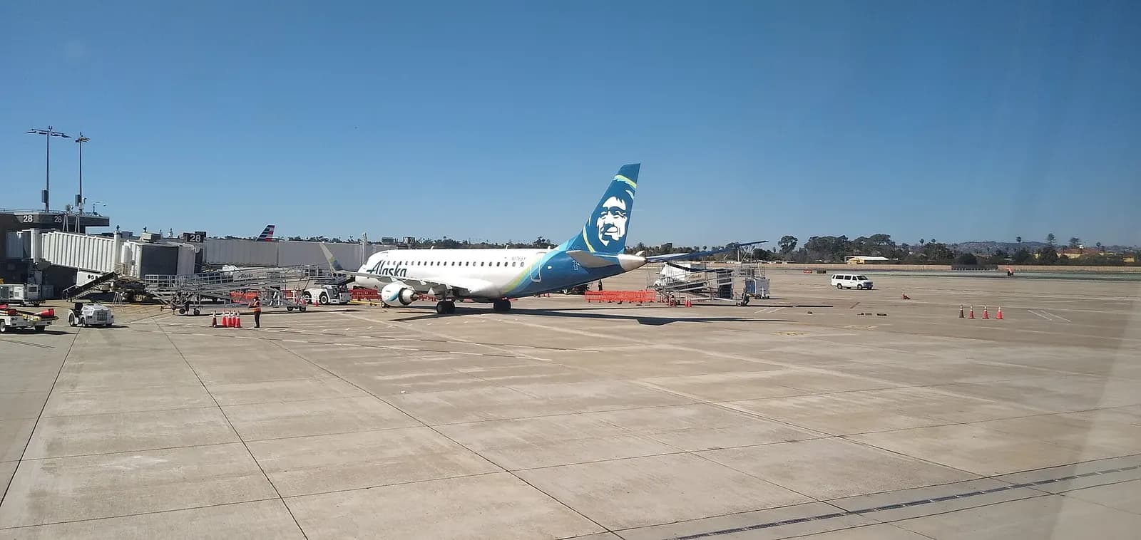 Embraer 175 registration N176SY operated by SkyWest Airlines for Alaska Airlines at San Diego International Airport
