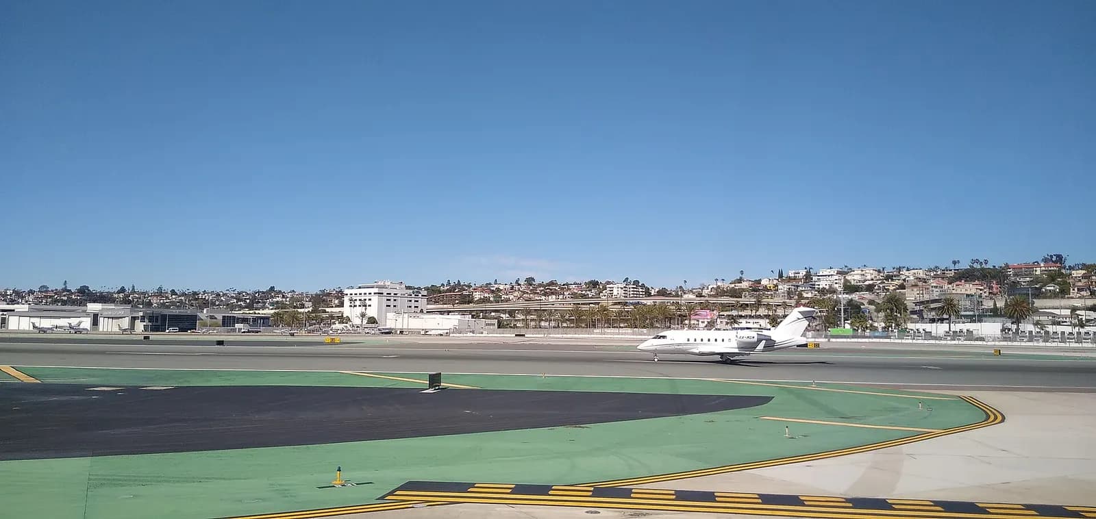 Bombardier Challenger 604, registration XA-MGM, begins its take off roll at San Diego International Airport