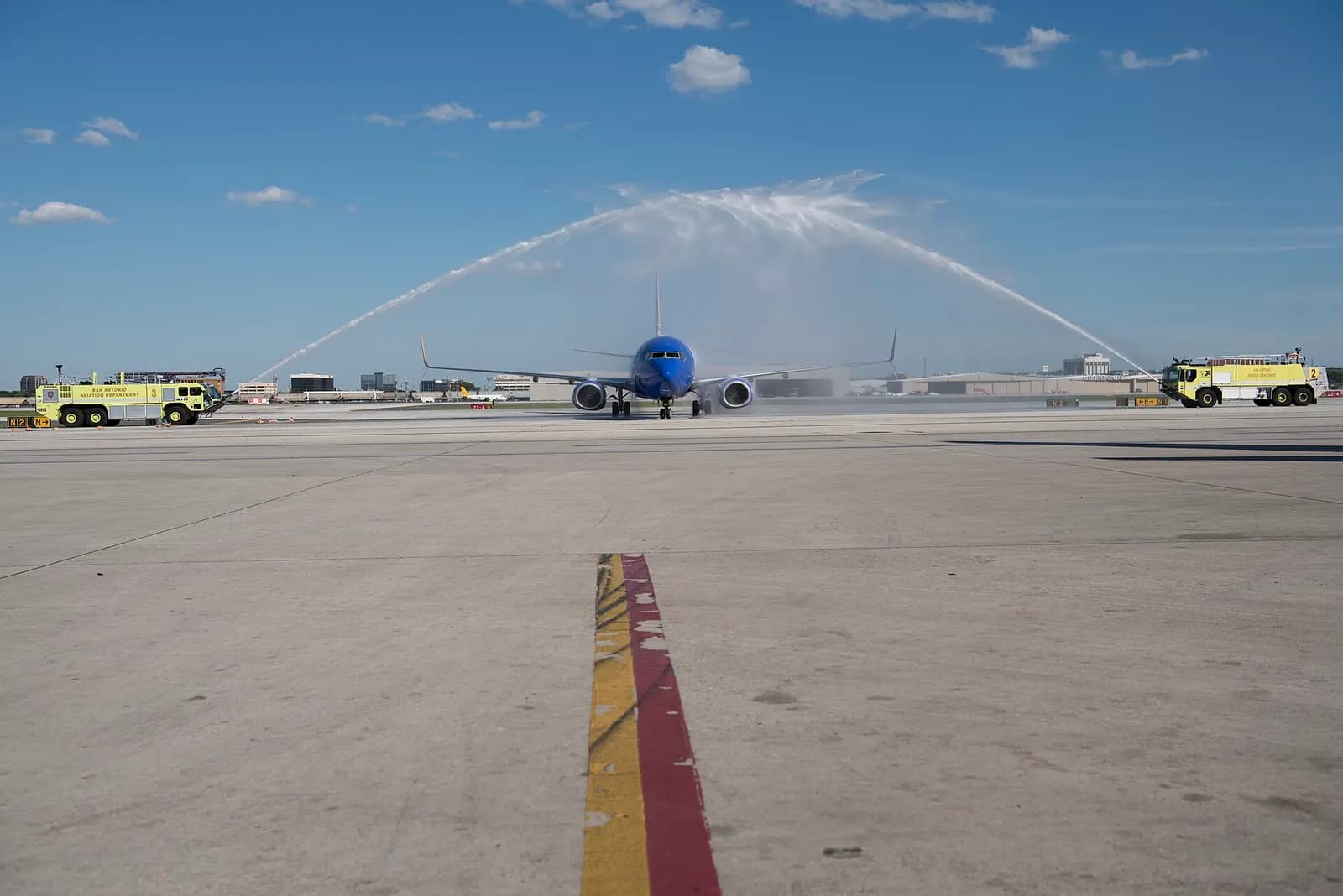 Veterans aboard the Honor Flight back from Washington D.C., are welcomed home with water cannons May 5, 2018 at the San Antonio International Airport. 40 World War 2, Vietnam War, and Korean War veterans were flown to Washington D.C. by Honor Flight San Antonio to see their war monuments and to comm