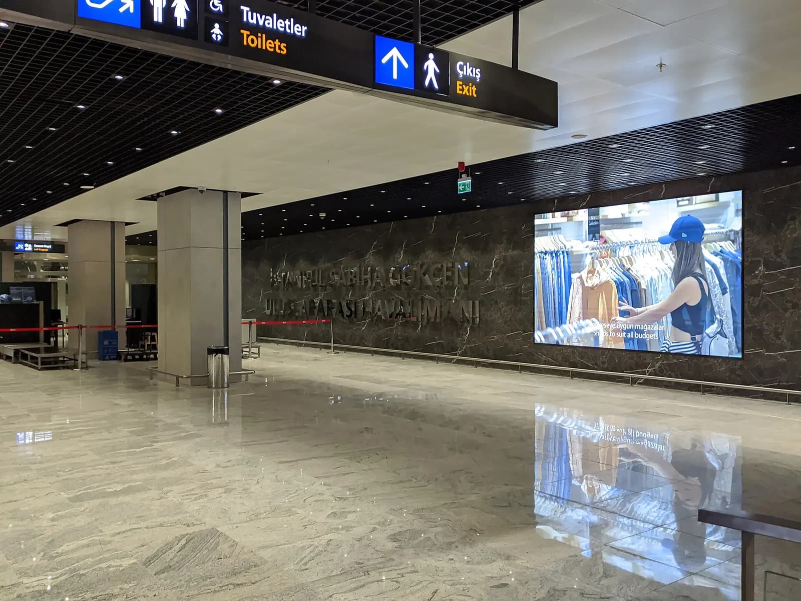 The marked Istanbul Metro entrance inside Sabiha Gökçen Airport terminal leading to the station.