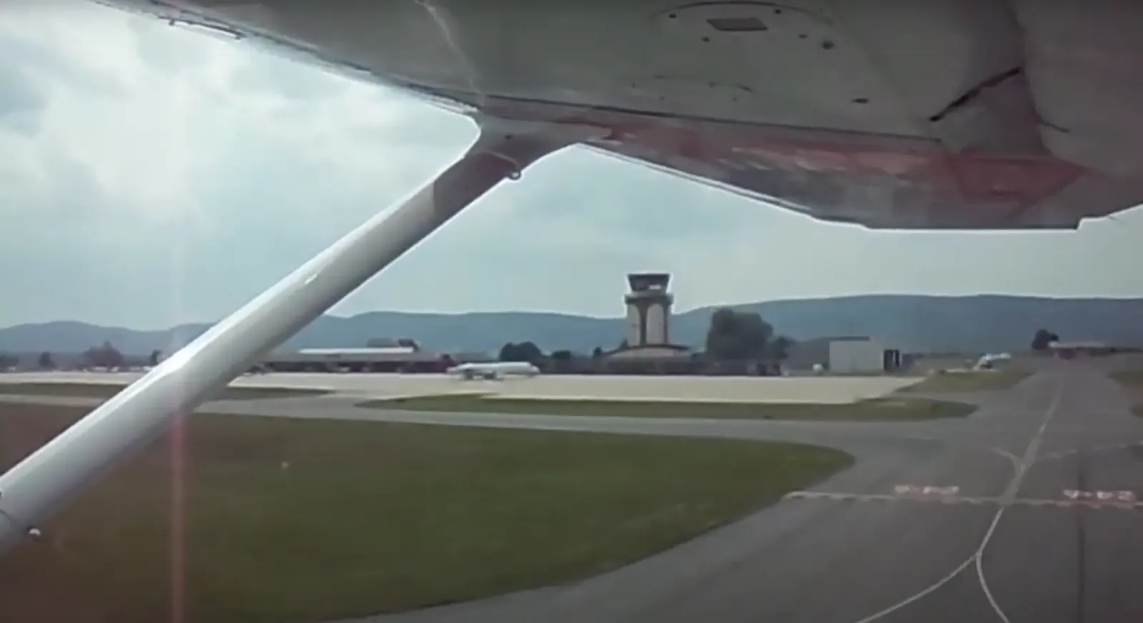 State College Regional Airport control tower and apron seen from a Cessna 172