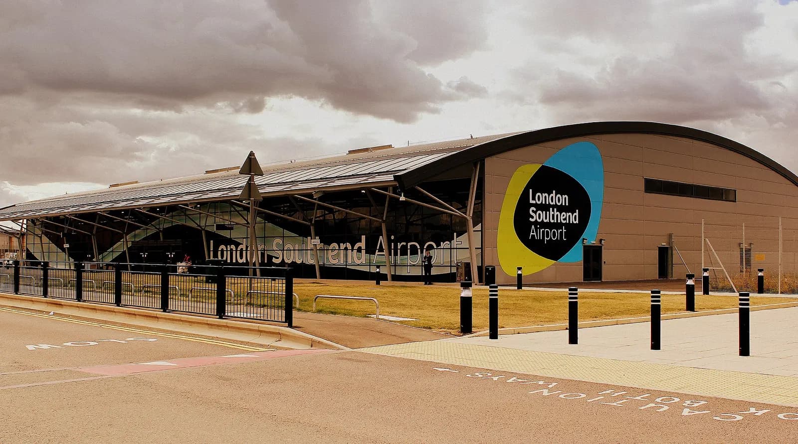 London Southend Airport terminal glass frontage and branded side wall