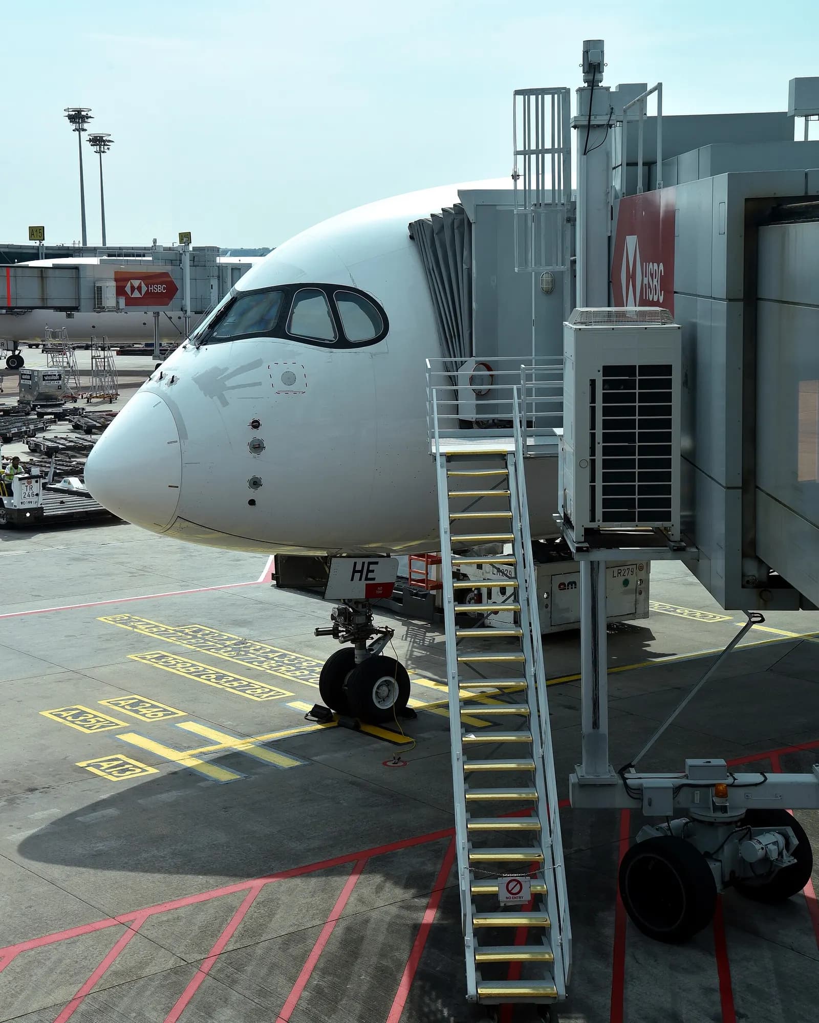 The nose of Singapore Airlines Airbus A350-941 9V-SHE at Gate A13, Terminal 3, Singapore Changi Airport (SIN/WSSS), with speed tape repairs clearly visible, following the aircraft's arrival from Tân Sơn Nhất International Airport (SGN/VVTS), Ho Chi Minh City, Vietnam, as SQ177