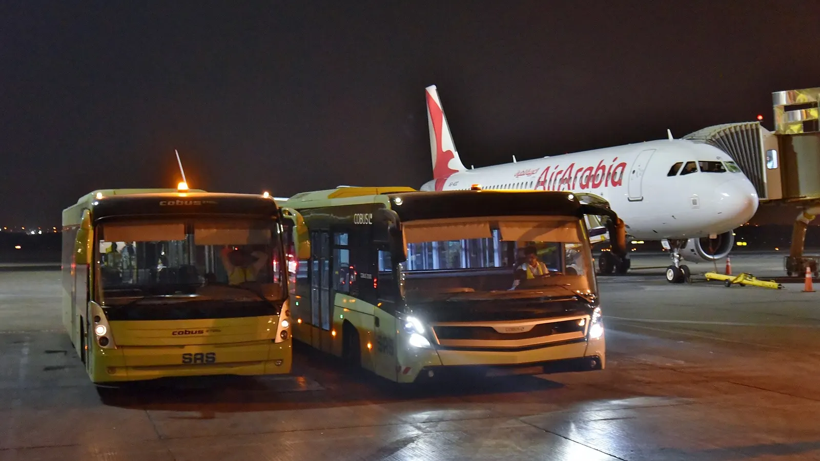 Sharjah Aviation Services (SAS) Cobus 2700s (left) and 3000 (right) airside transfer buses, at Sharjah International Airport (SHJ/OMSJ), United Arab Emirates