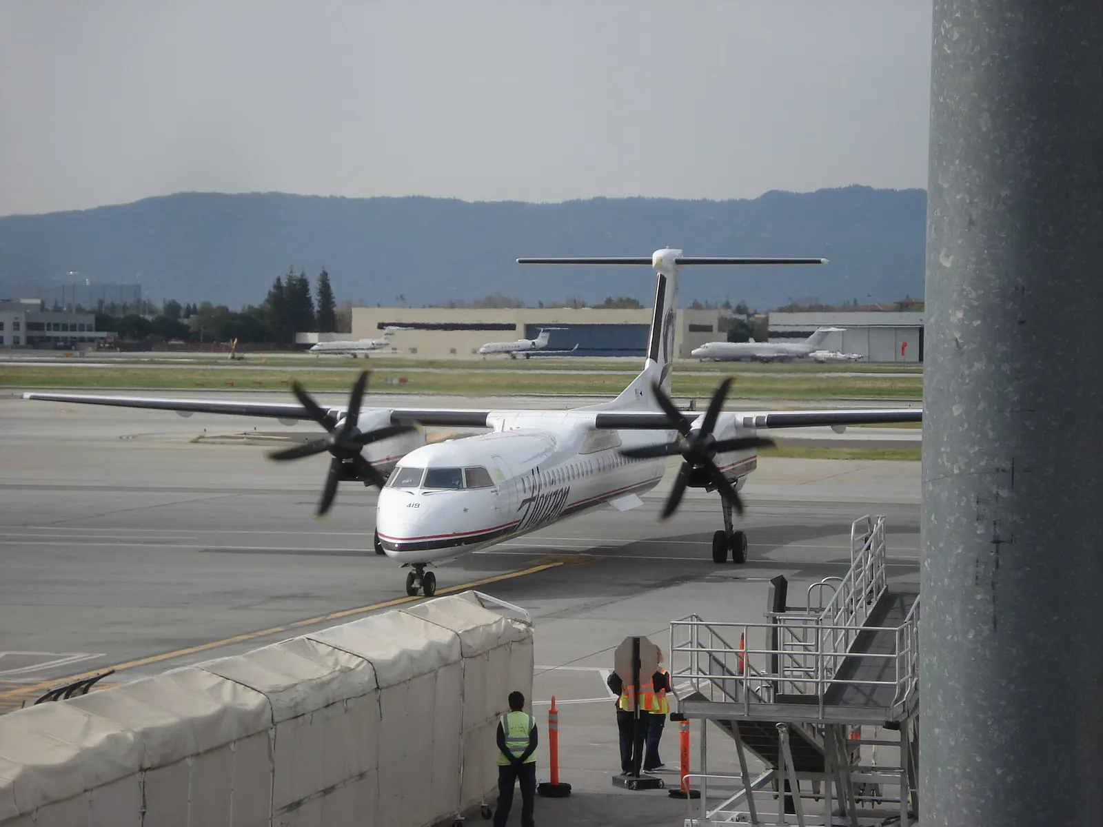 A Horizon Air Q400 arrives at San Jose International Airport Terminal C