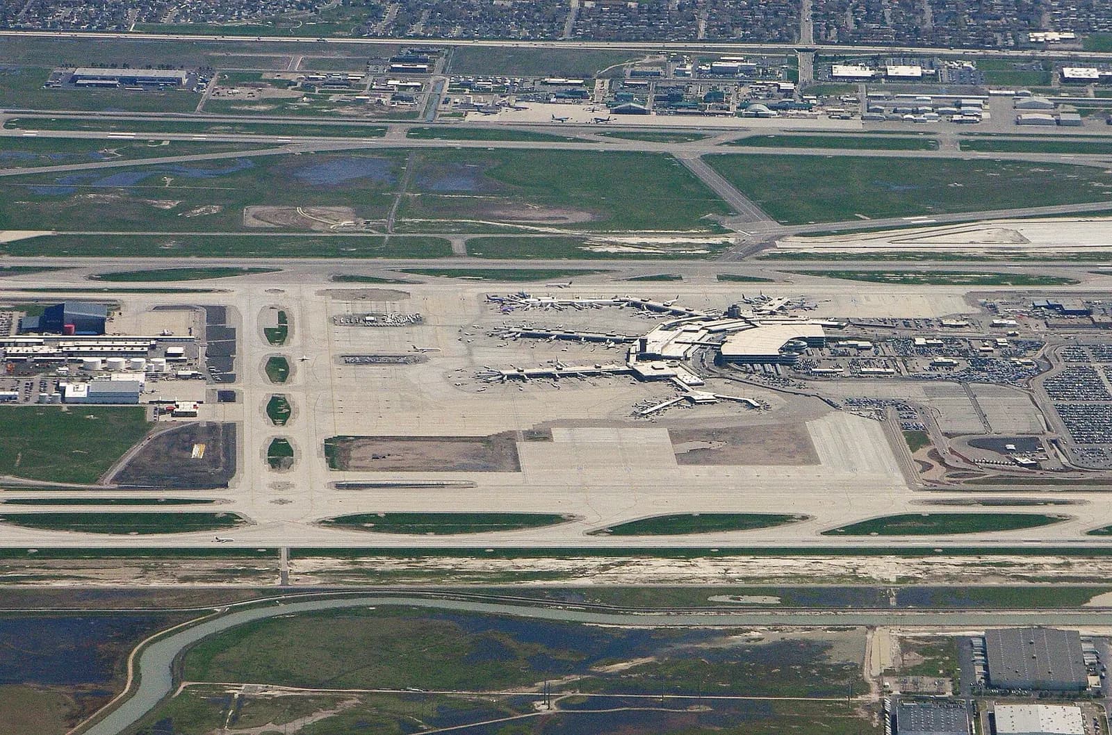 Exterior view of the Salt Lake City International Airport terminal buildings and surrounding structures.