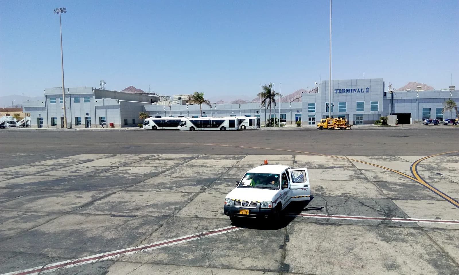Sharm el-Sheikh International Airport from the inside. Neoplan N 9112 buses are parked at the terminal