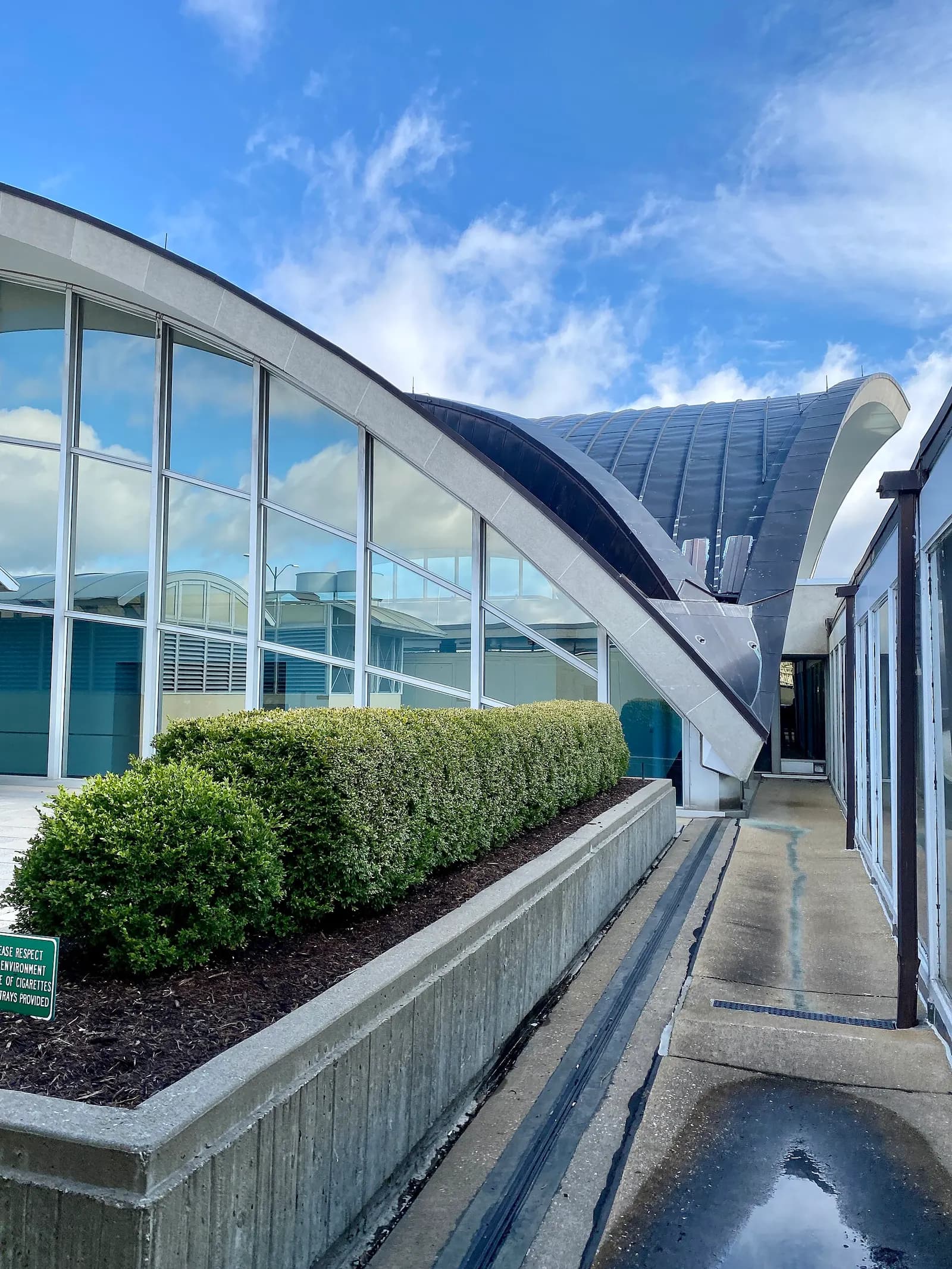 Built in 1953-1956, this Modern building was designed by Minoru Yamasaki to serve as the main airport terminal for St. Louis Lambert International Airport. The building was expanded in 1965 with a matching addition, expanding the main hall of the landslide head house of the terminal to its present s
