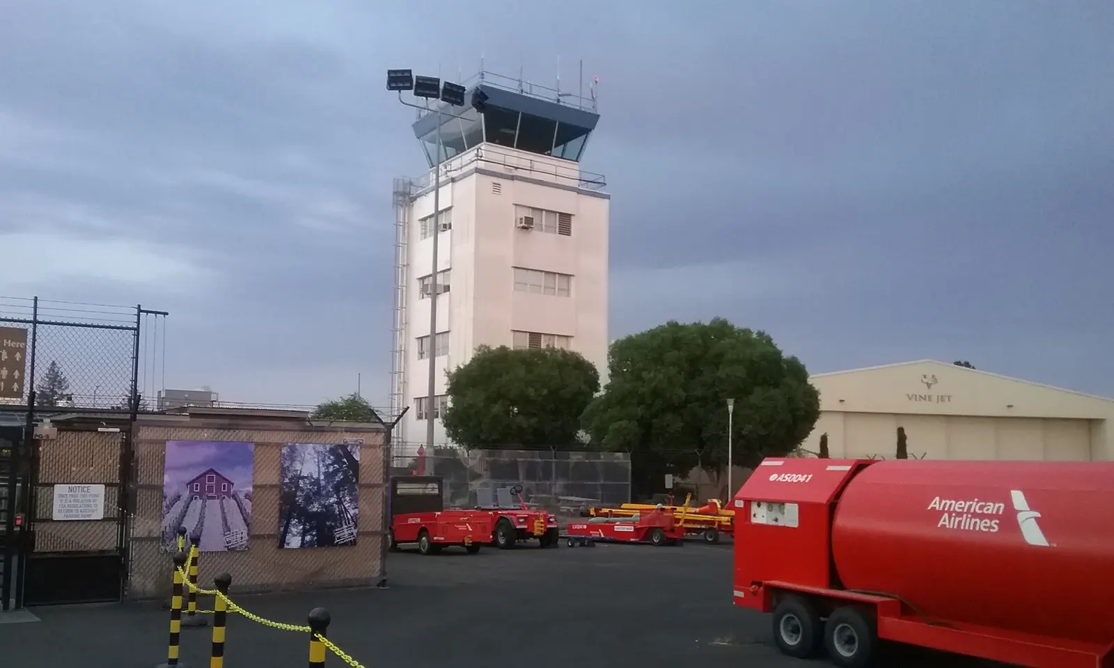 Control tower at Charles M. Schulz–Sonoma County Airport with airport vehicles in the foreground on 11 September 2017.