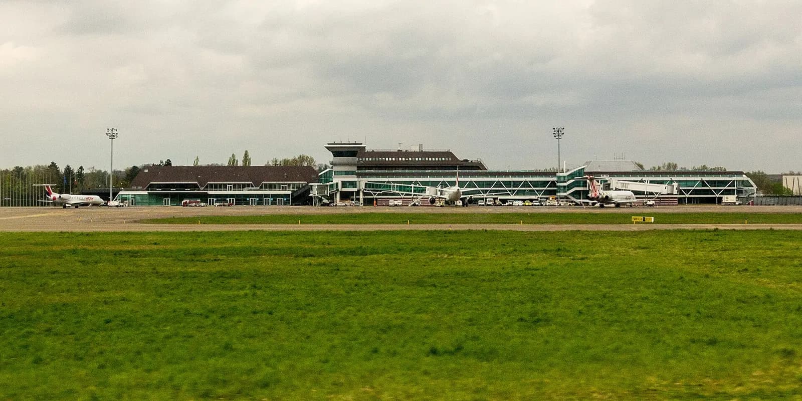 Wide landside panorama of Strasbourg-Entzheim Airport terminal