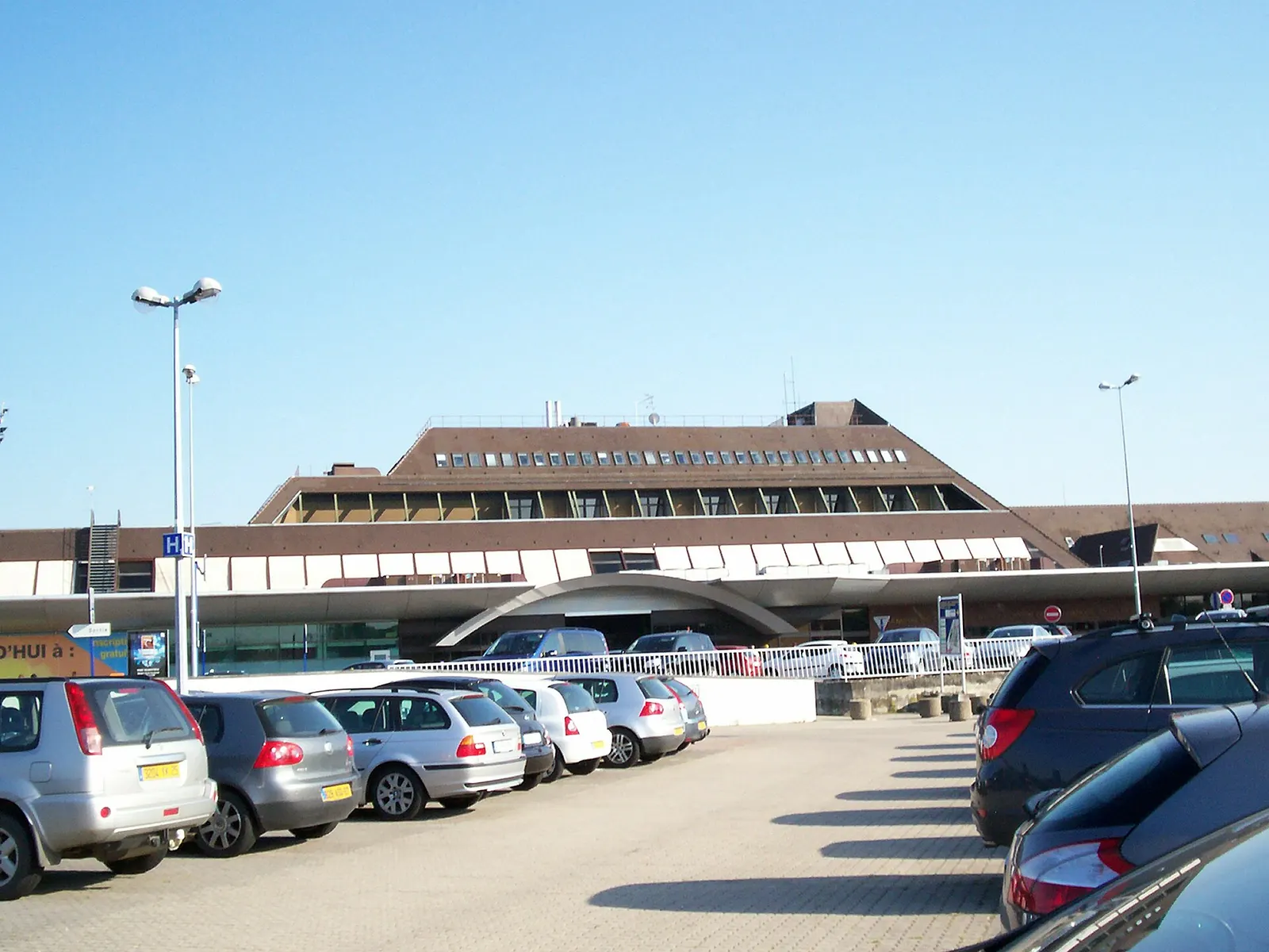 Exterior of Strasbourg-Entzheim Airport passenger terminal under a clear sky