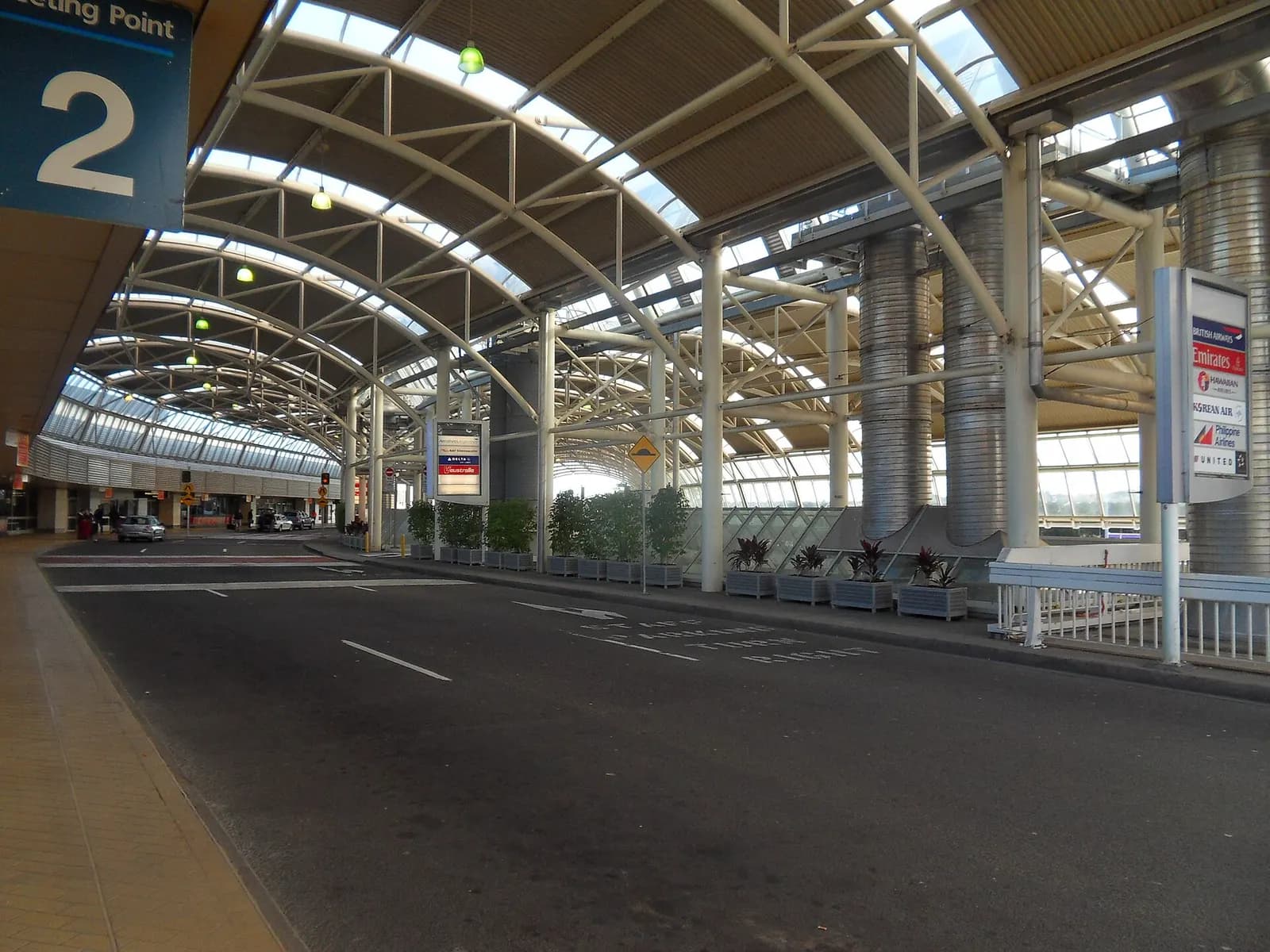 The covered international departures drop-off zone with kerbside lanes for vehicles outside Terminal 1.