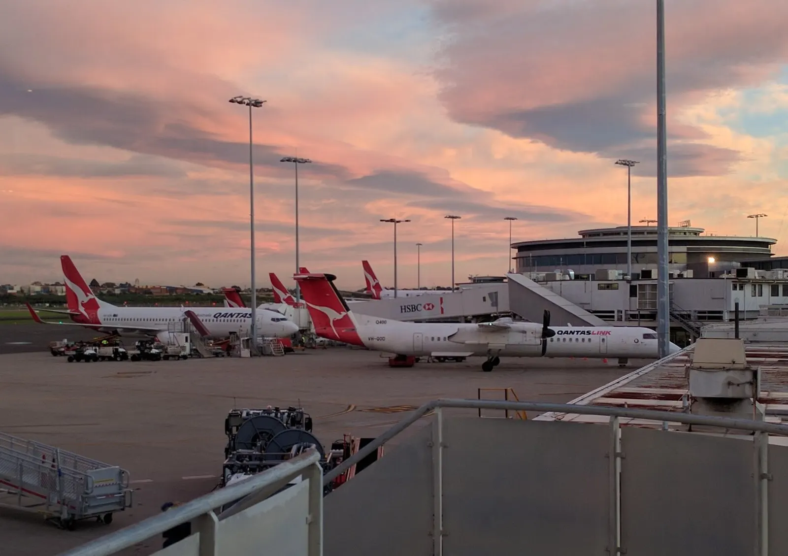 The regional flights terminal interior shows check-in counters and small aircraft visible through the windows.