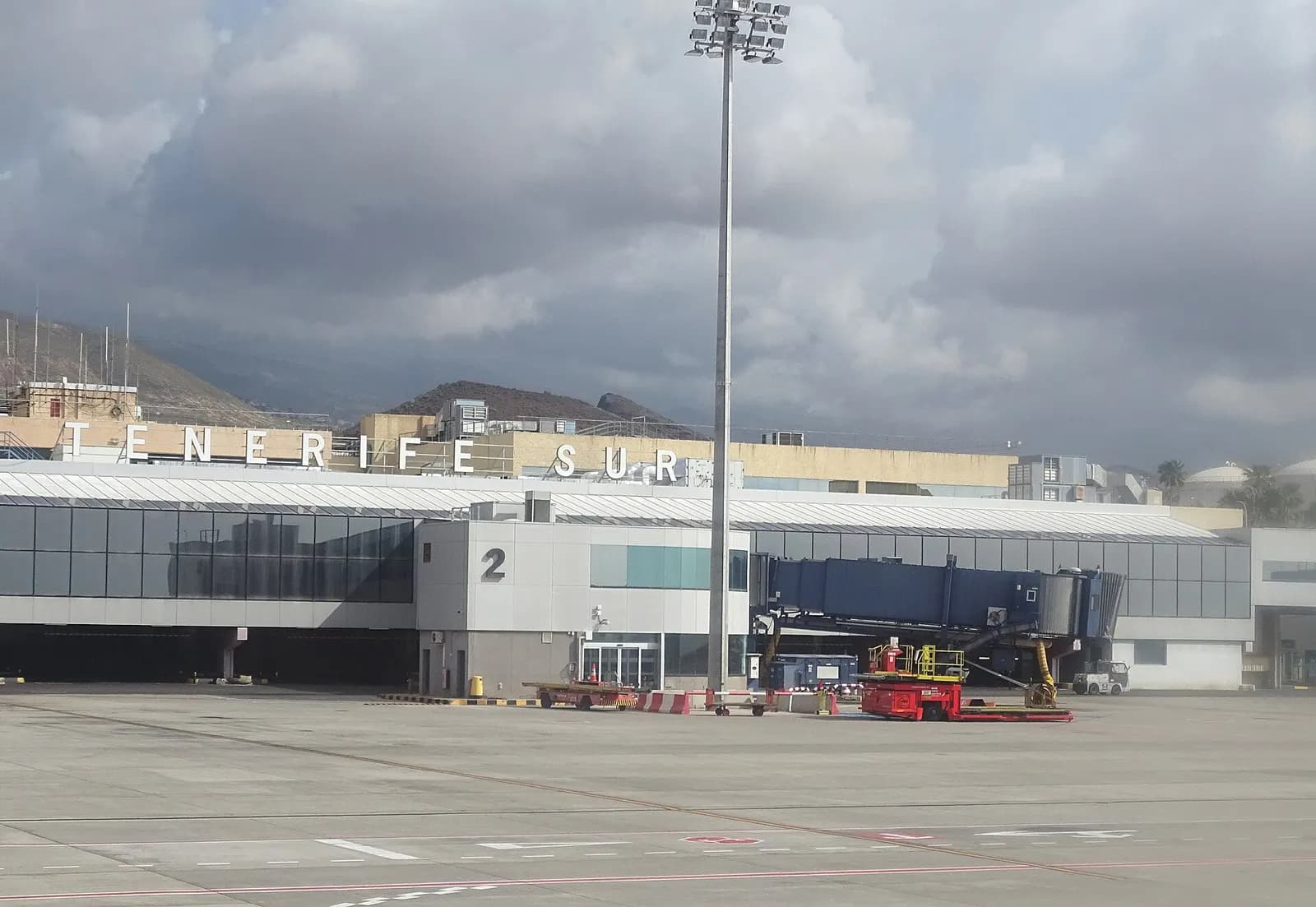 Wide exterior of Tenerife South Airport landside façade and forecourt