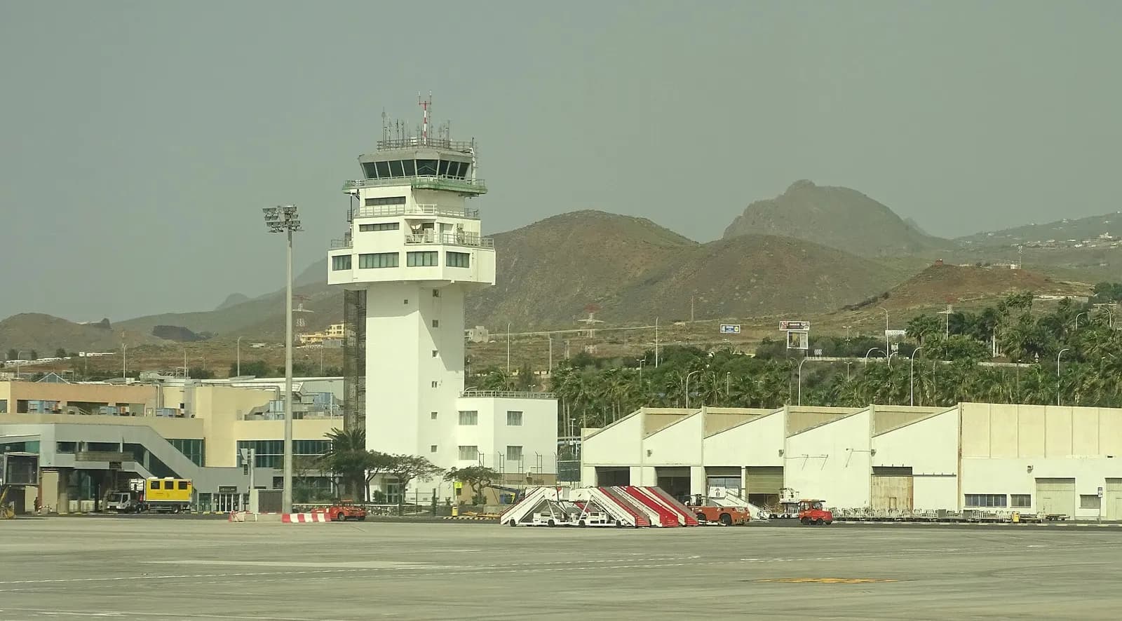 Exterior view of Tenerife South Airport terminal buildings under clear skies