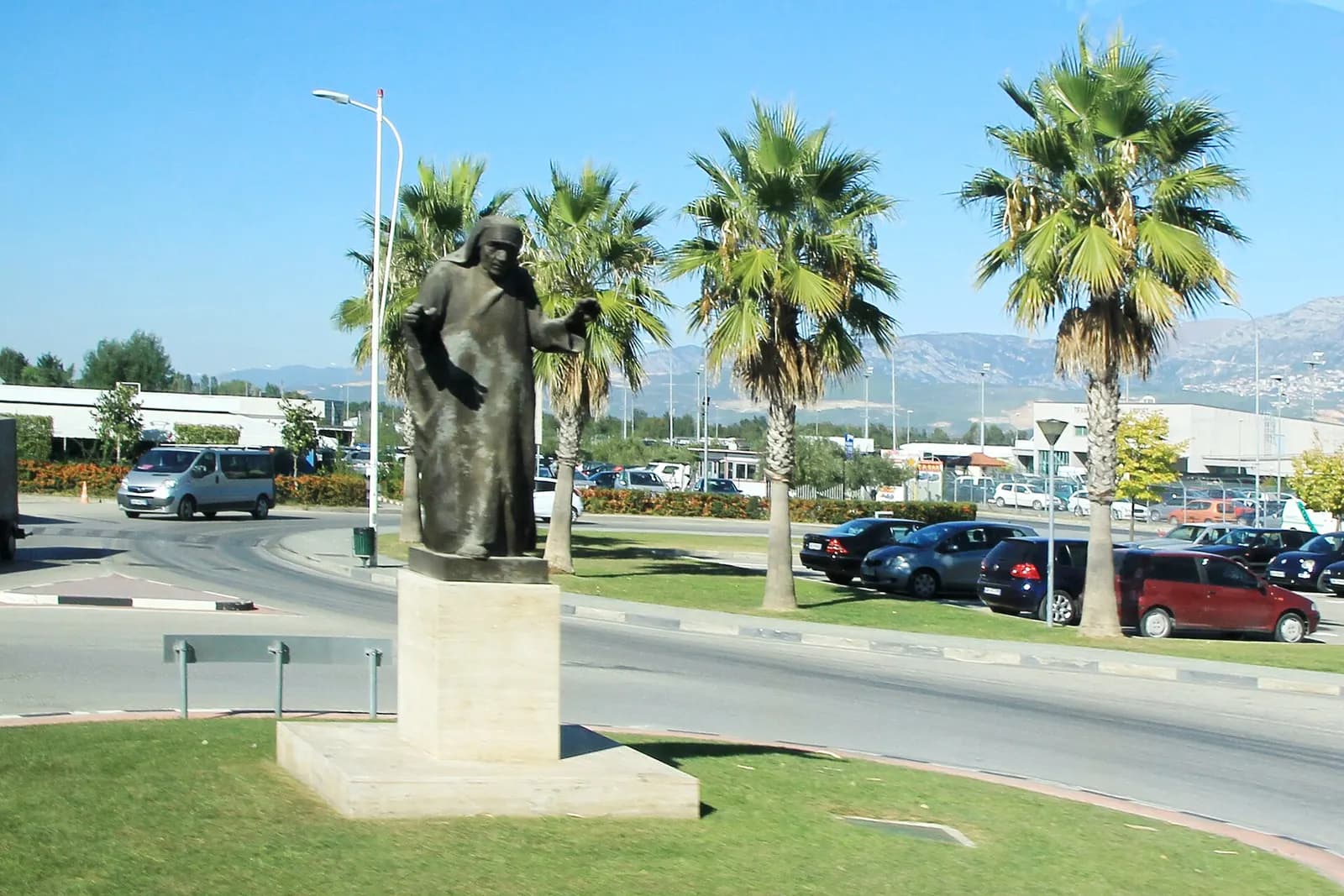 Bronze statue of Mother Teresa on the roundabout in front of Tirana International Airport