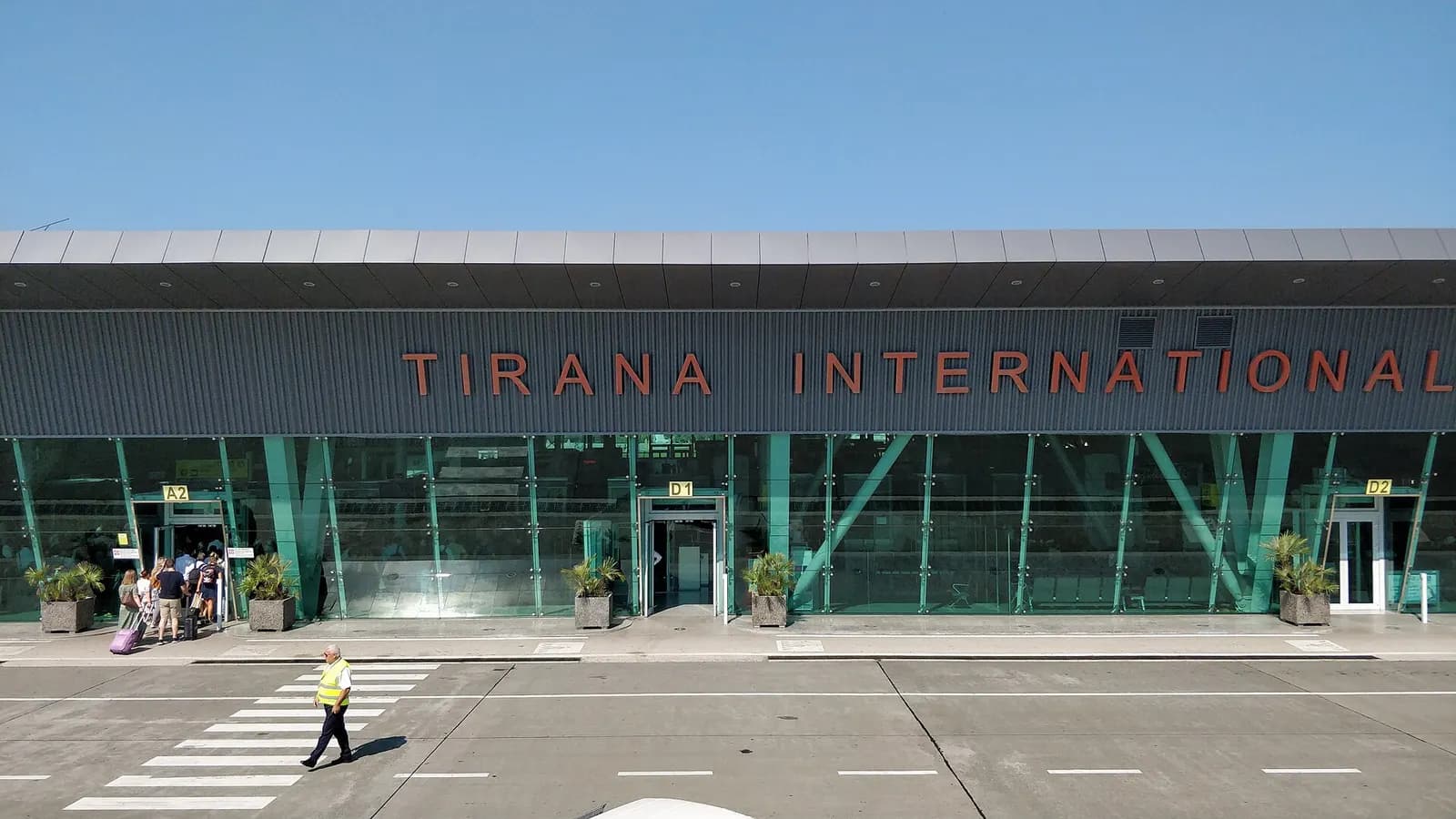 Close view of the Tirana International glass facade and passenger entrances A2, D1 and D2