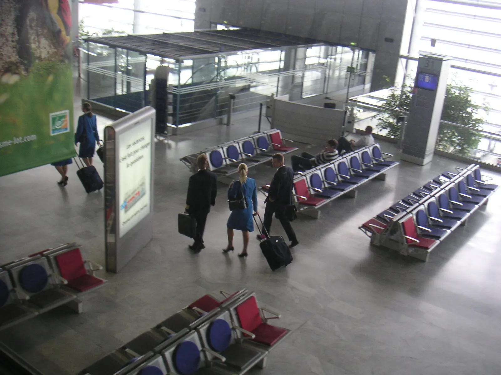 Departure hall interior at Toulouse-Blagnac Airport.