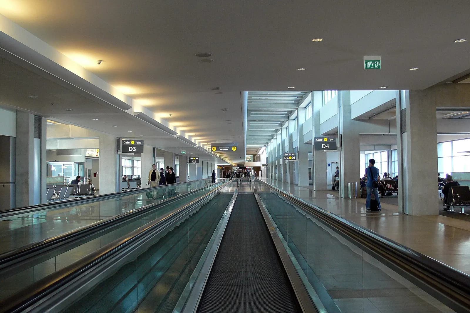 A moving walkway in the Terminal 3 Pier D boarding area leading passengers toward their departure gate.