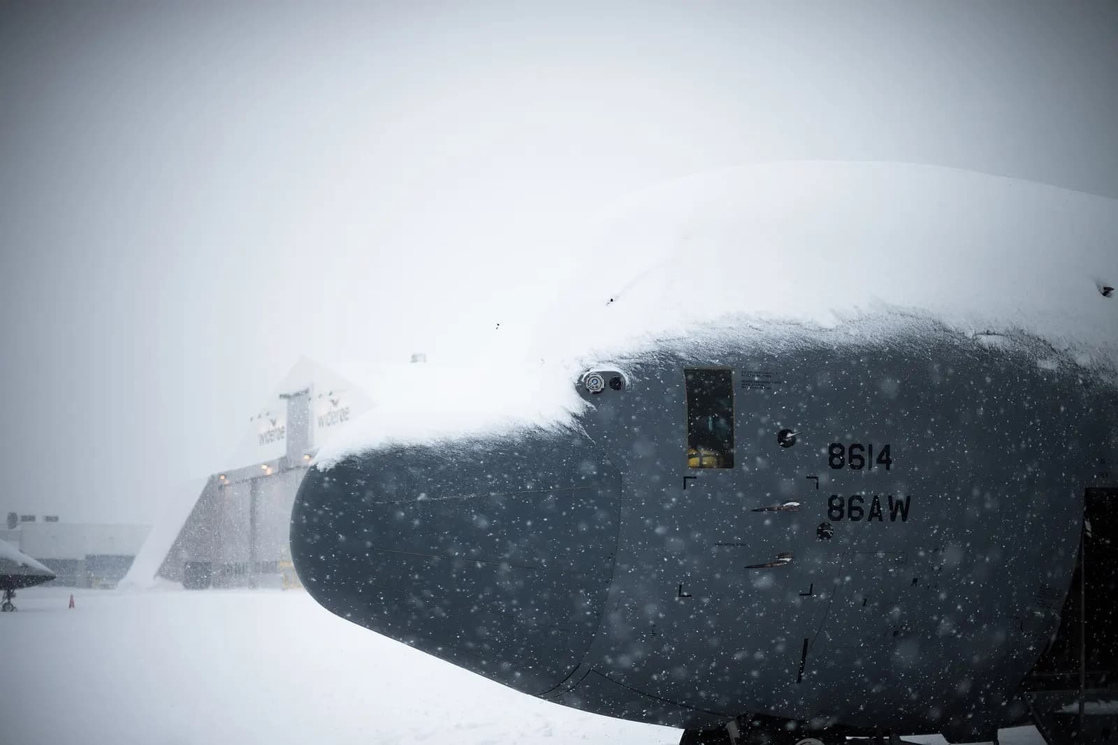 Snow covers the top of a U.S. Air Force C-130J Super Hercules assigned to the 37th Airlift Squadron, Ramstein Air Base, Germany, at Tromsø Airport, Norway, Feb. 29, 2020. The 37th AS supported Tactical Air Control Party Airmen assigned to the 2nd Air Support Operations Squadron, Vilseck, Germany, an
