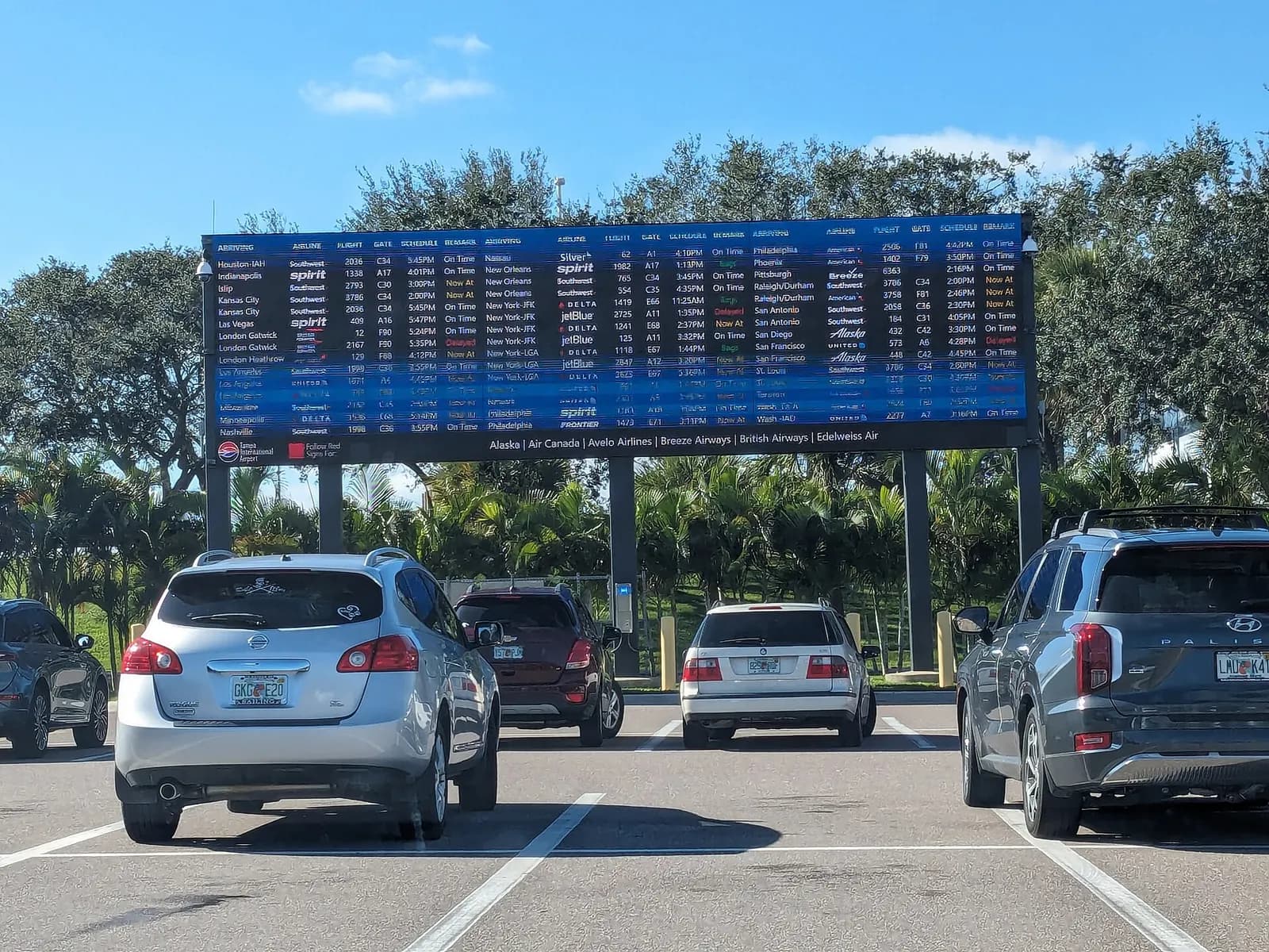 Arrival board in cell phone lot at Tampa International Airport .