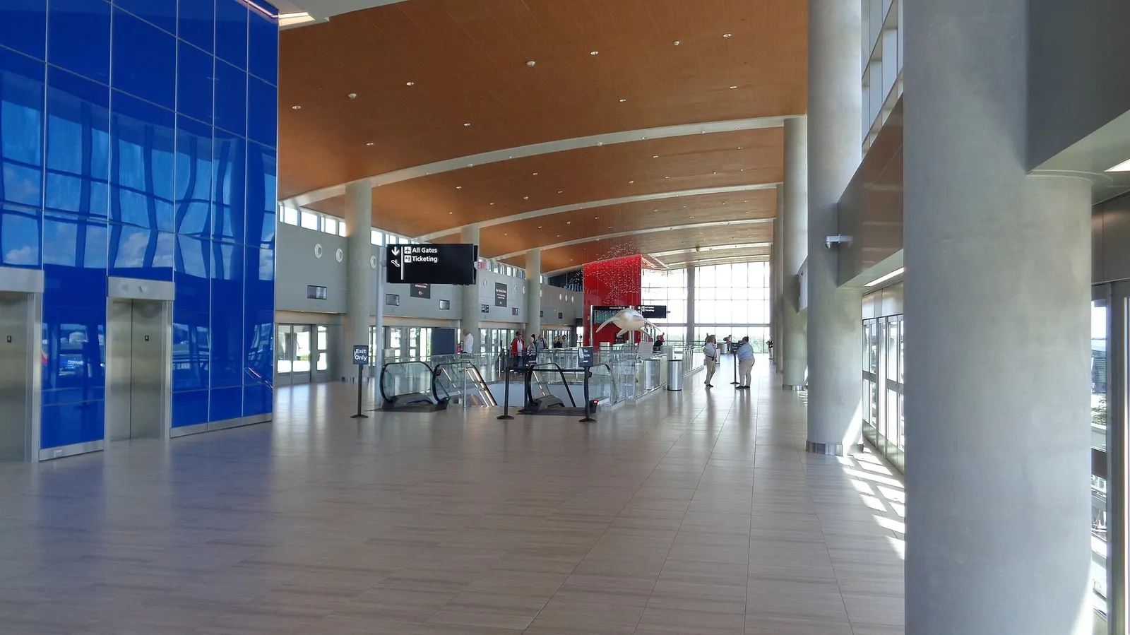 Inside the SkyConnect station at Tampa International Airport's main terminal, showing the automated people mover platform and signage.