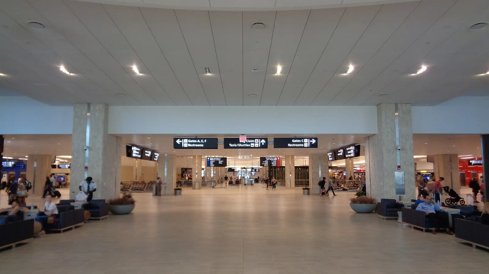 Interior of Tampa International Airport main terminal Level 3 showing the transfer hall where passengers connect to airside shuttles.